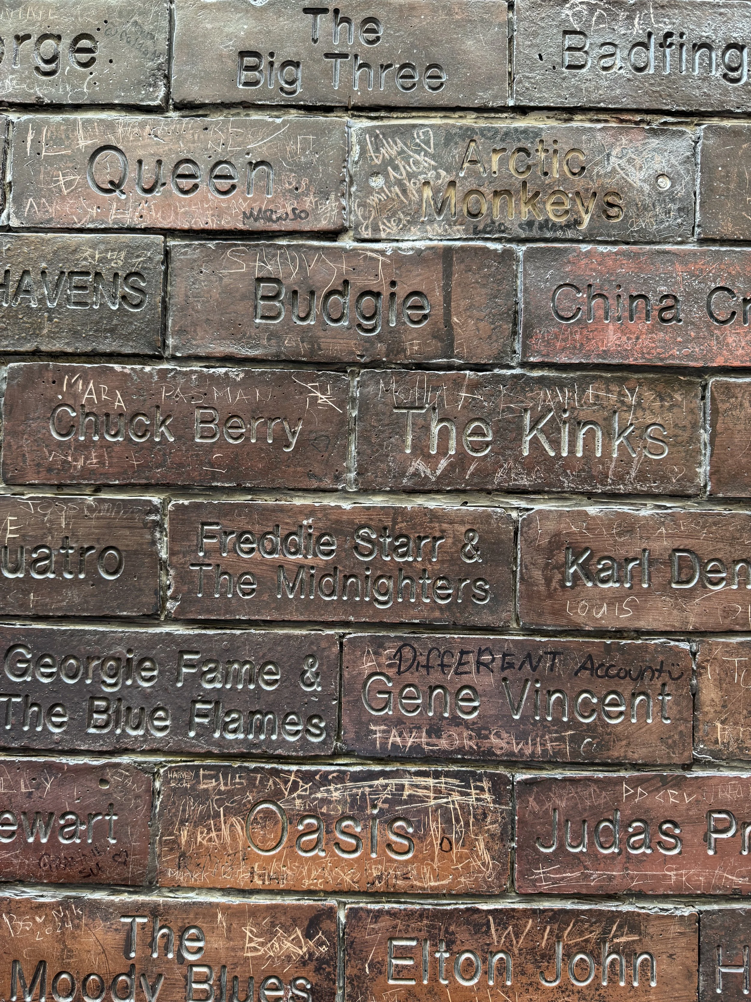 Names carved into the Cavern Wall of Fame, Mathew Street, Liverpool