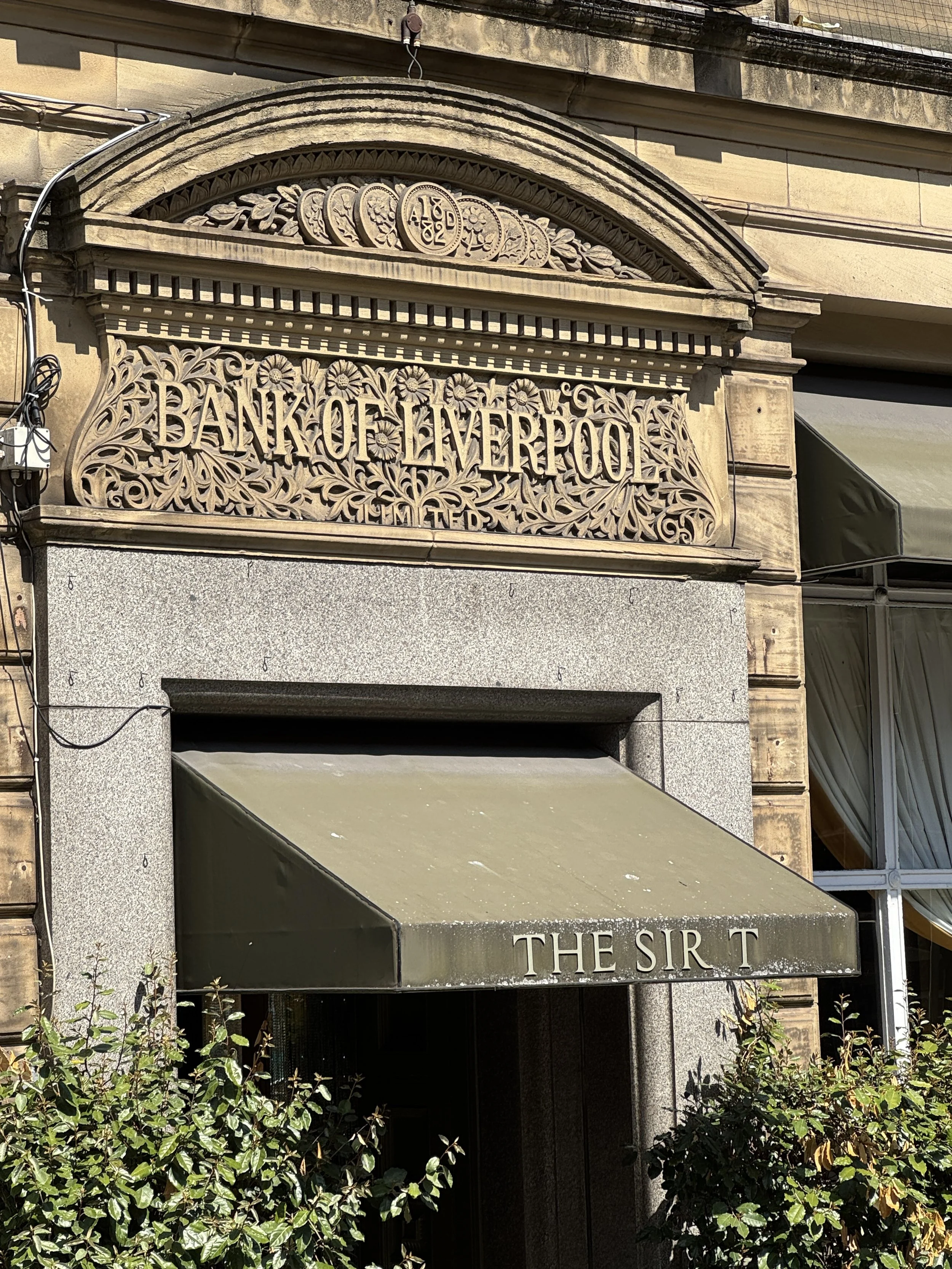 Ornate stone shopfront in Liverpool city centre