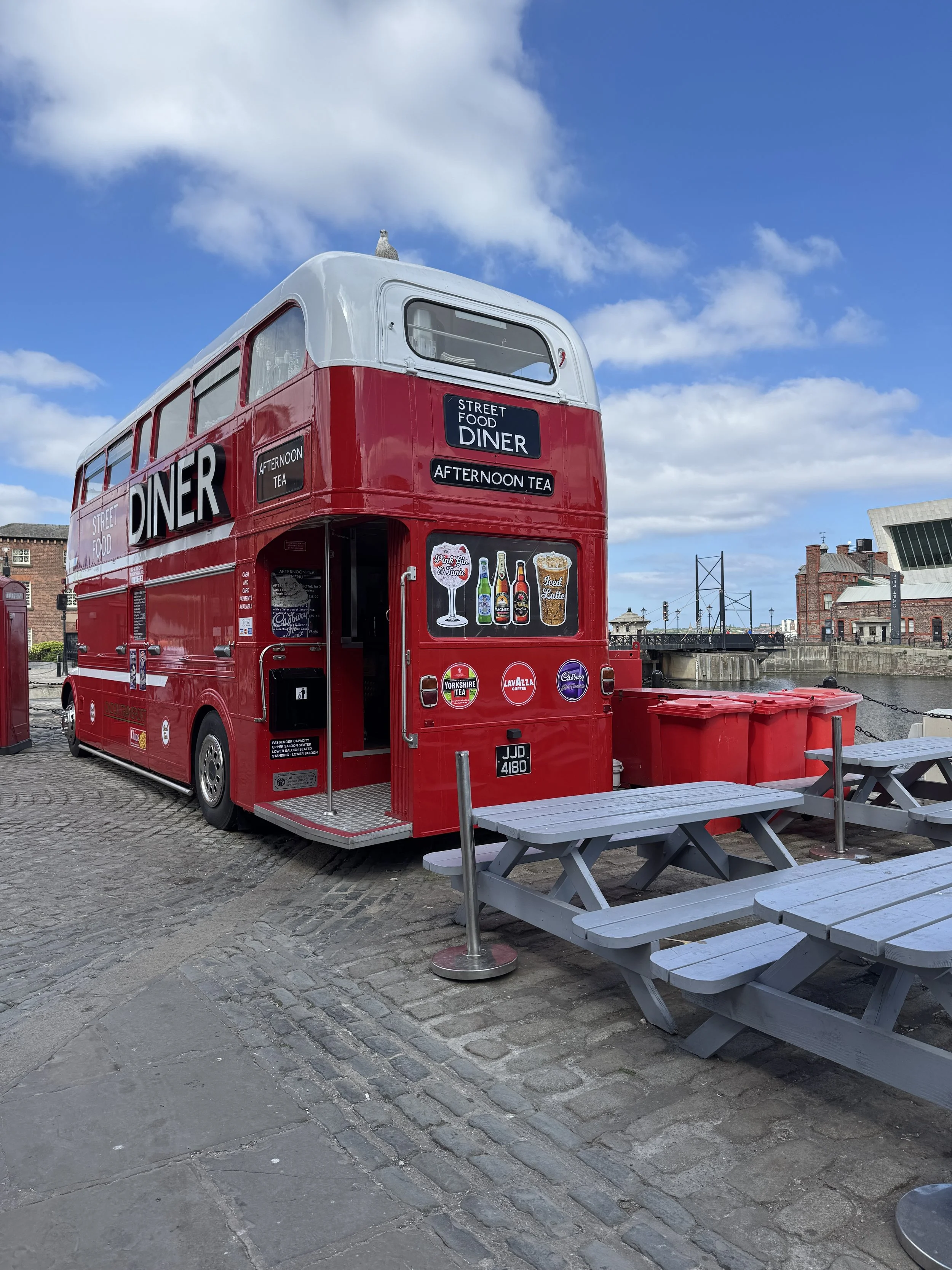 Red vintage double-decker bus café at Royal Albert Dock, Liverpool