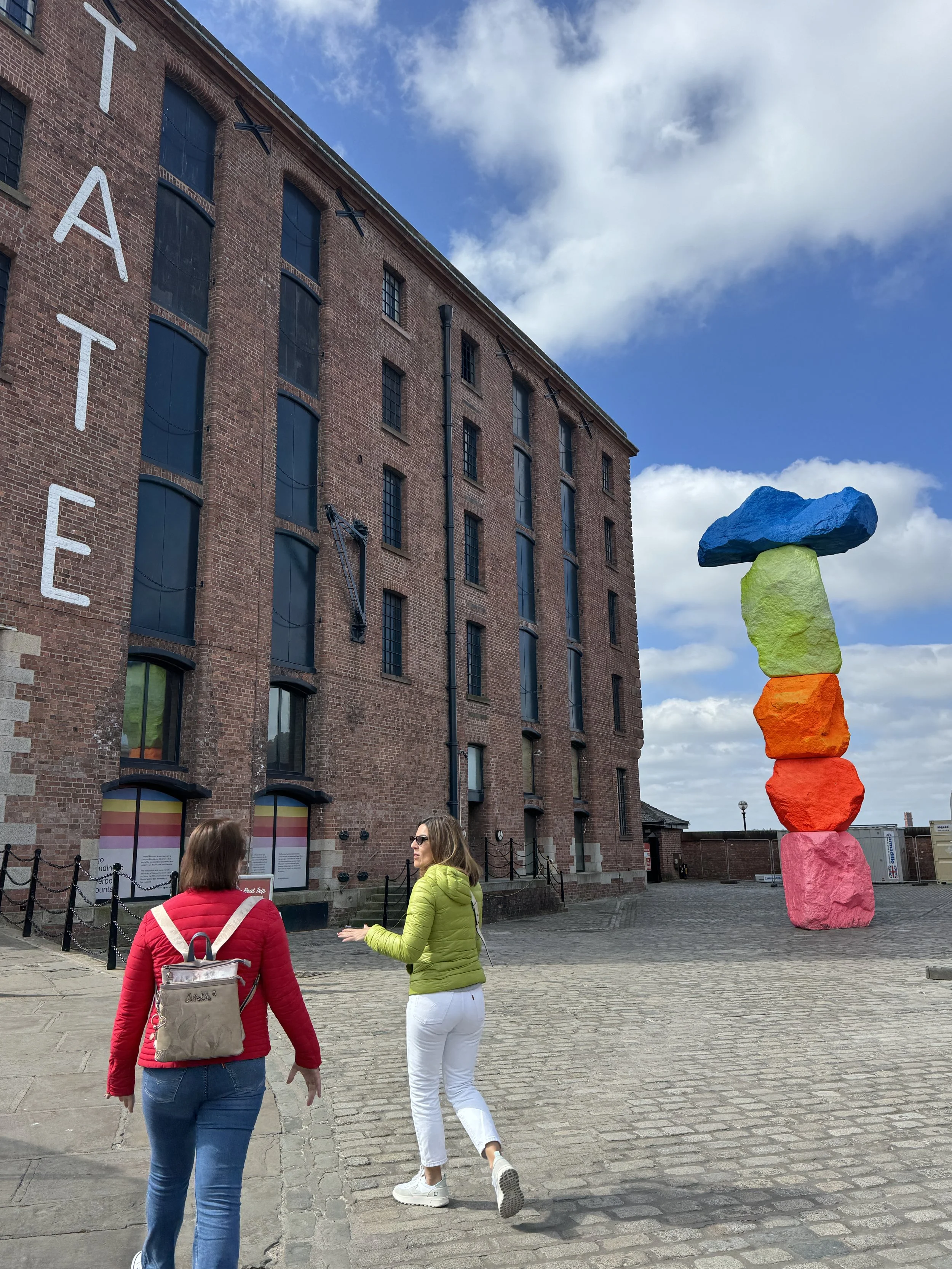 Royal Albert Dock warehouses with colourful sculpture, Liverpool