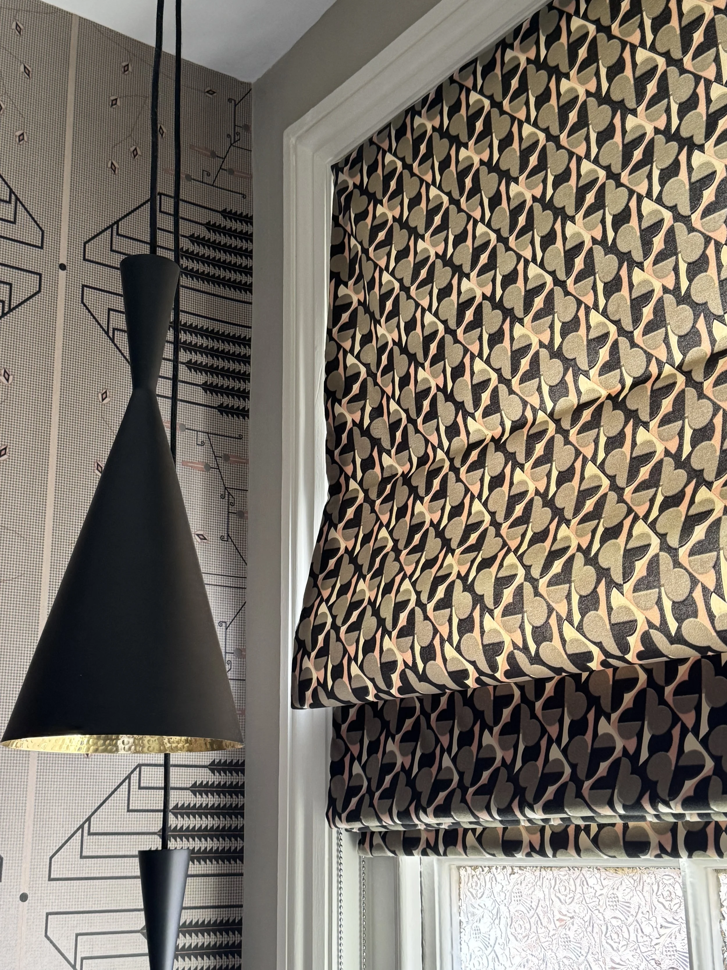  Contemporary Roman blind with geometric patterned velvet fabric and original frosted Edwardian glass in an entrance hall. 