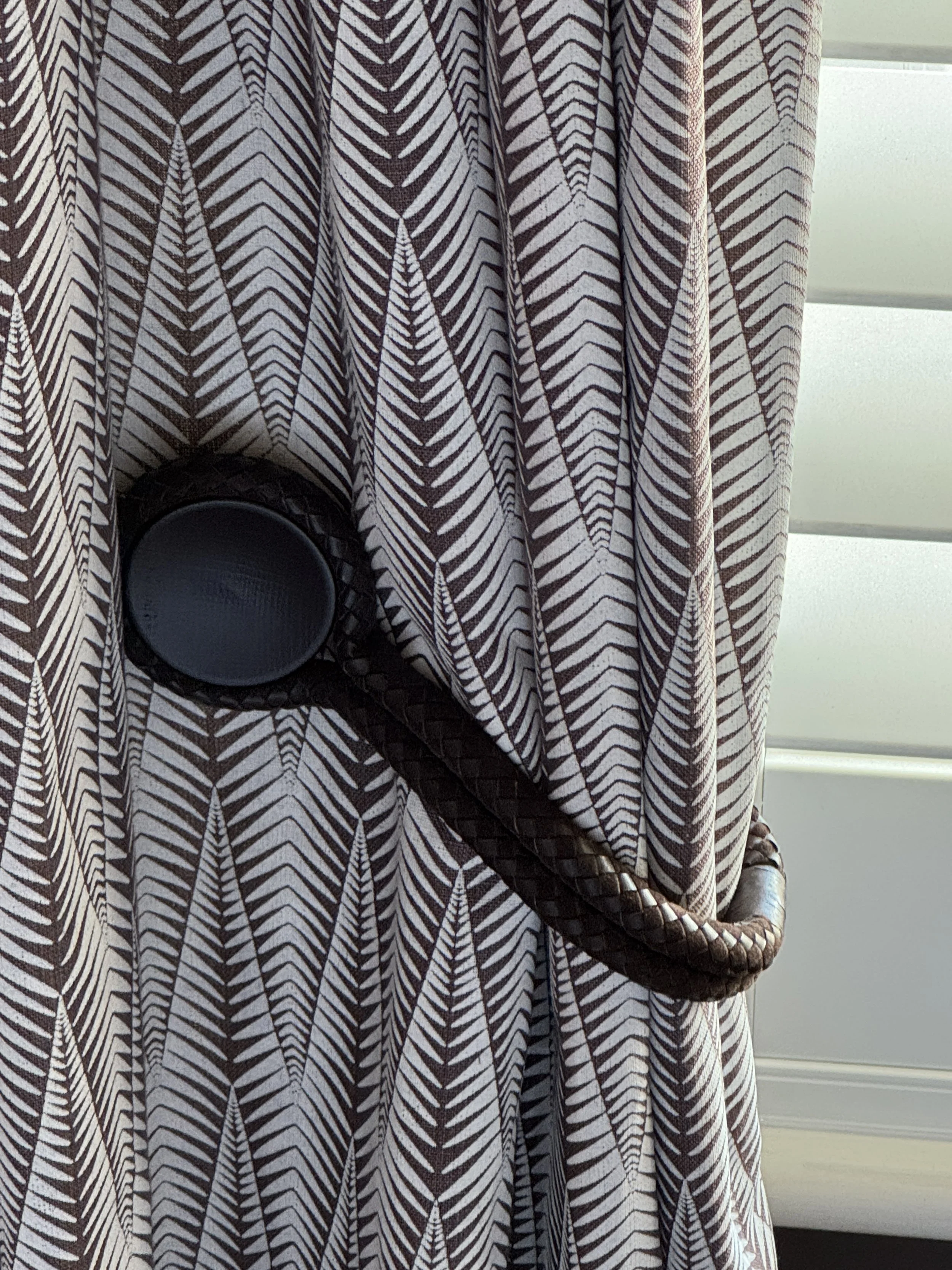 A simple leather tieback adds texture and character.