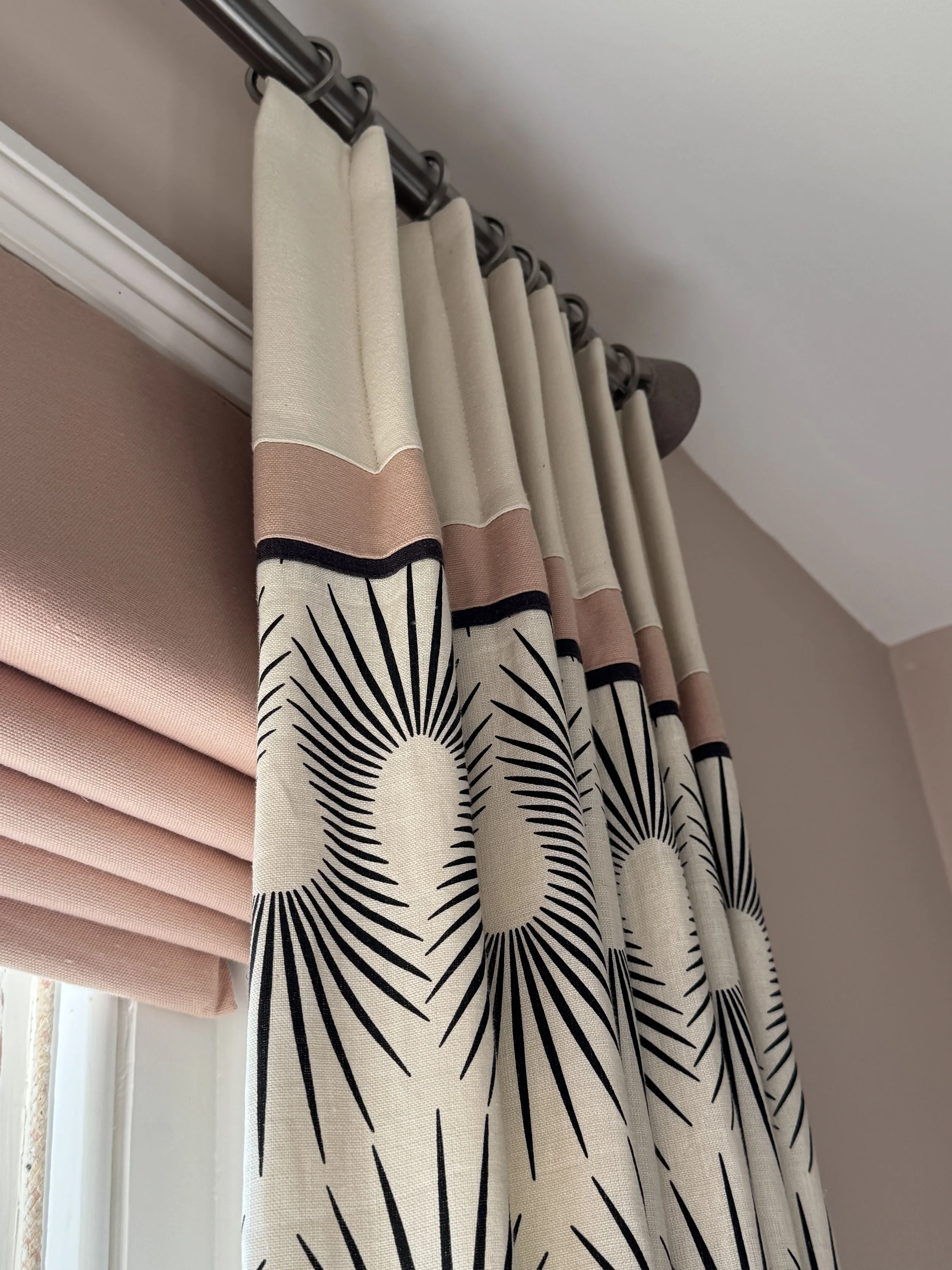 Layering curtains and blinds adds softness, depth and practicality.