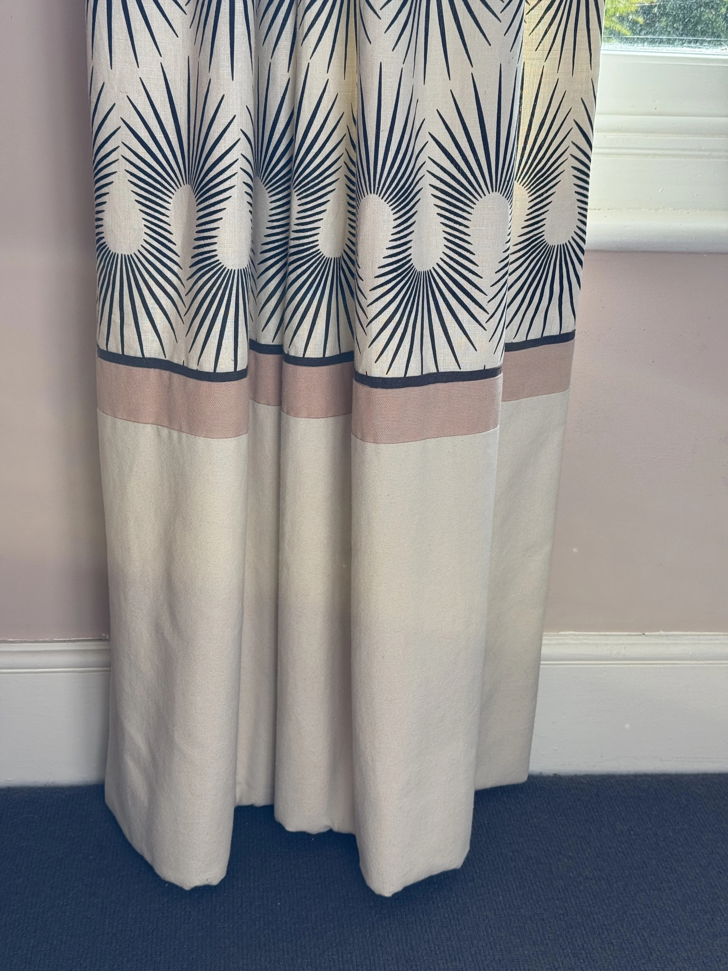 Mirrored detailing at the hem brings balance to the design.