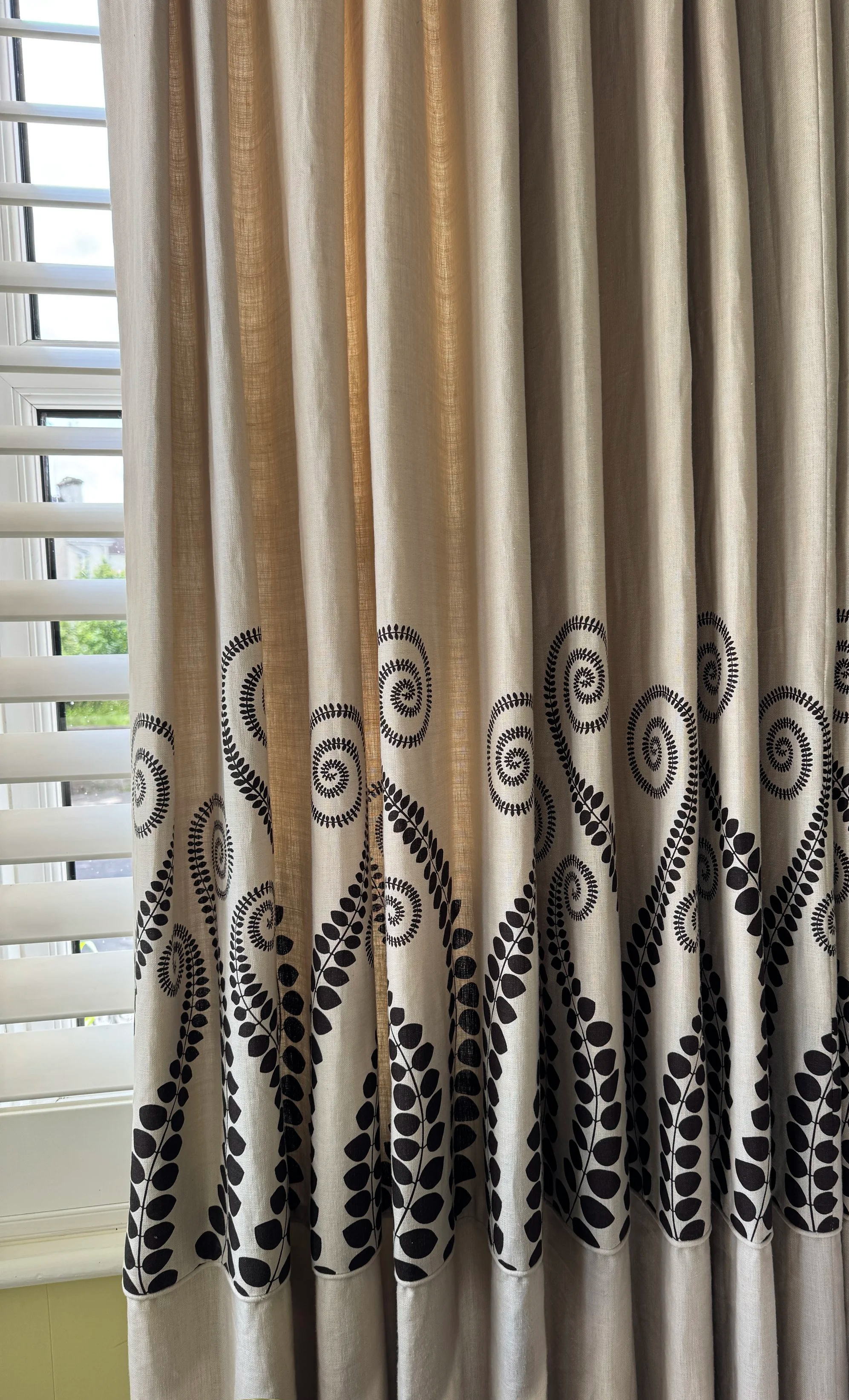  Detailed views of bespoke linen curtains demonstrating pattern alignment, tailored curtain making and decorative fabric placement. 