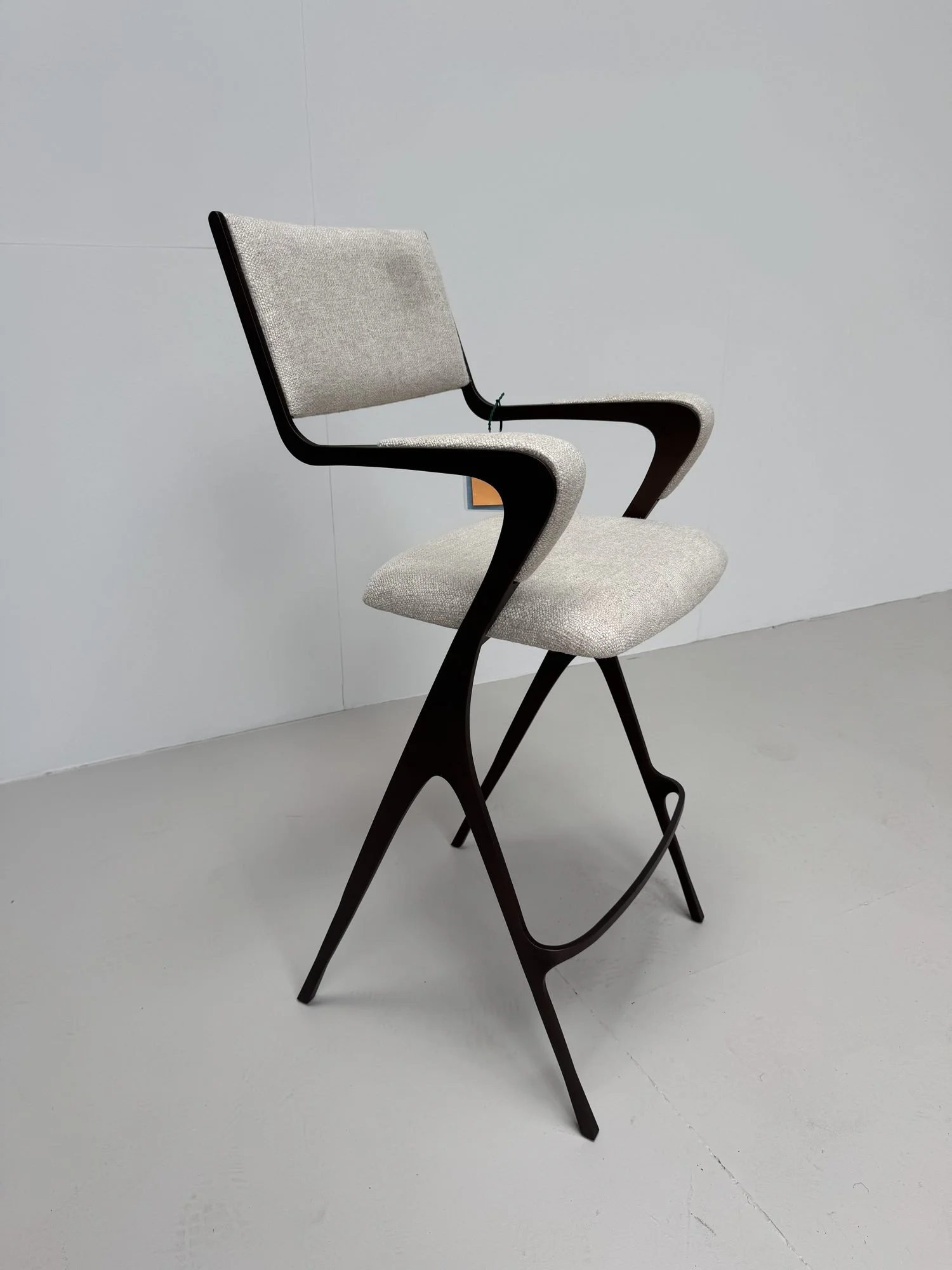 Upholstered bar stool, side view