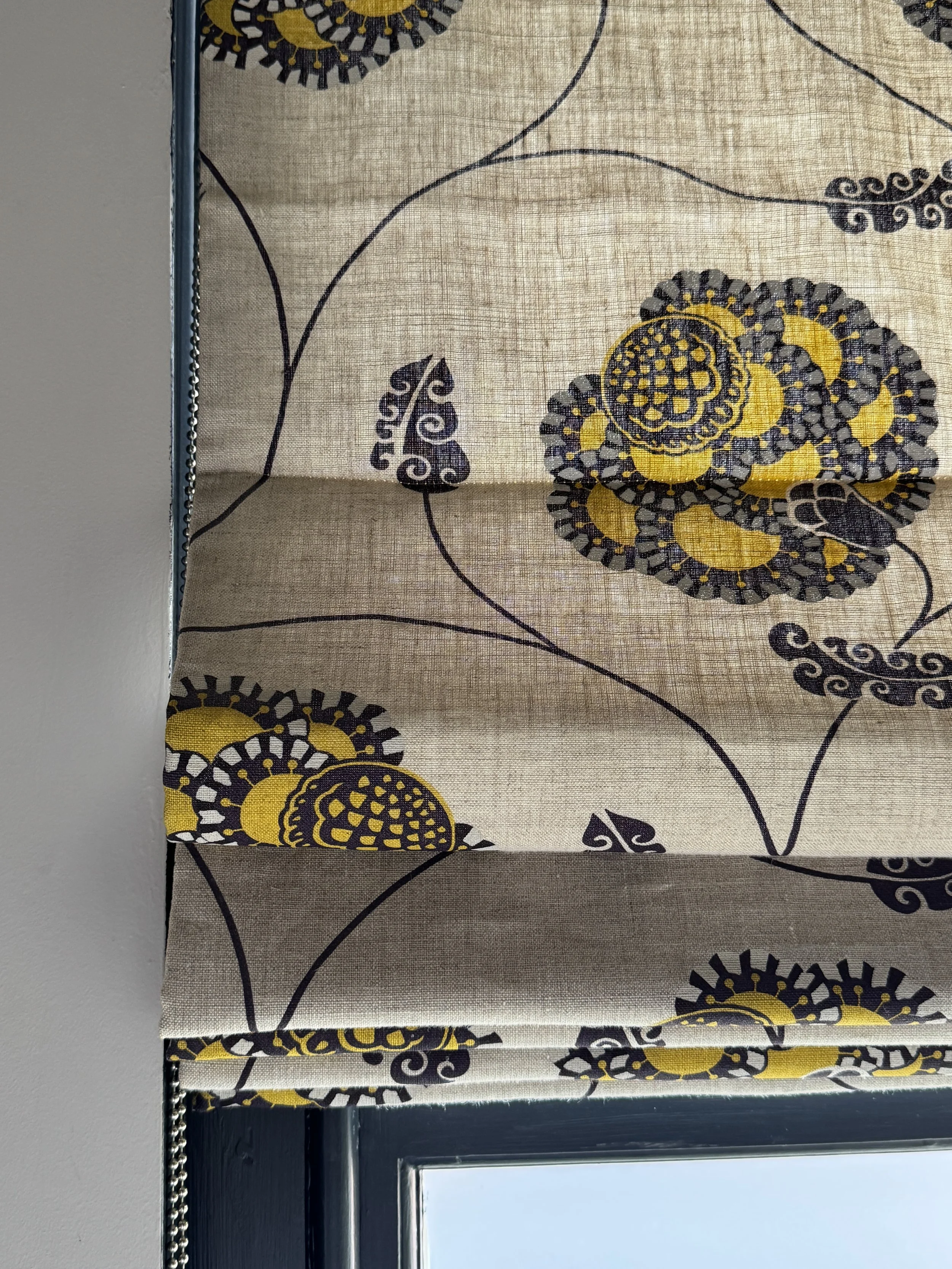 Bespoke Roman blind in Neisha Crosland Flamenco Yolk fabric, bold floral pattern.