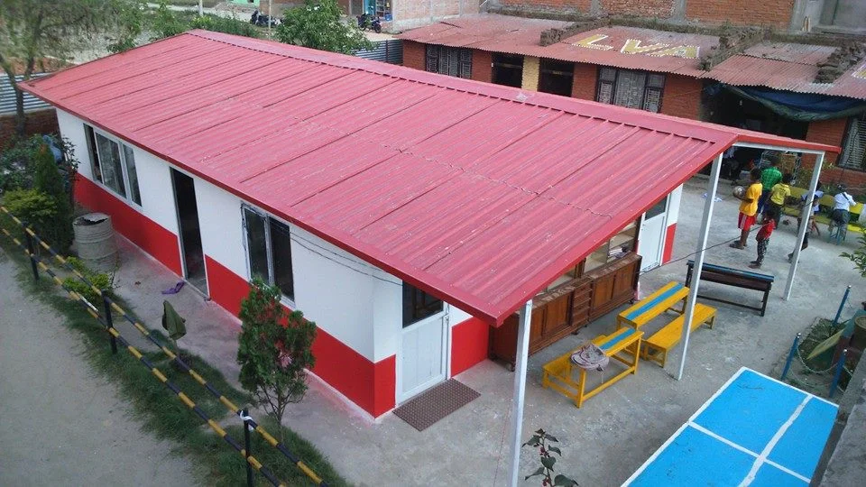 CYF's first fabricated house provided our children a temporary shelter from rainy nights.