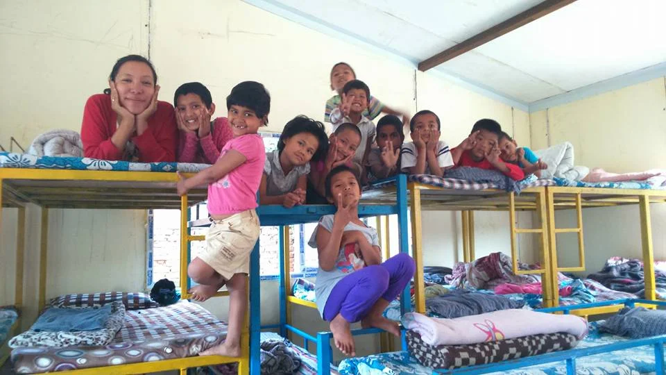 Haushala and the children in our first fabricated house