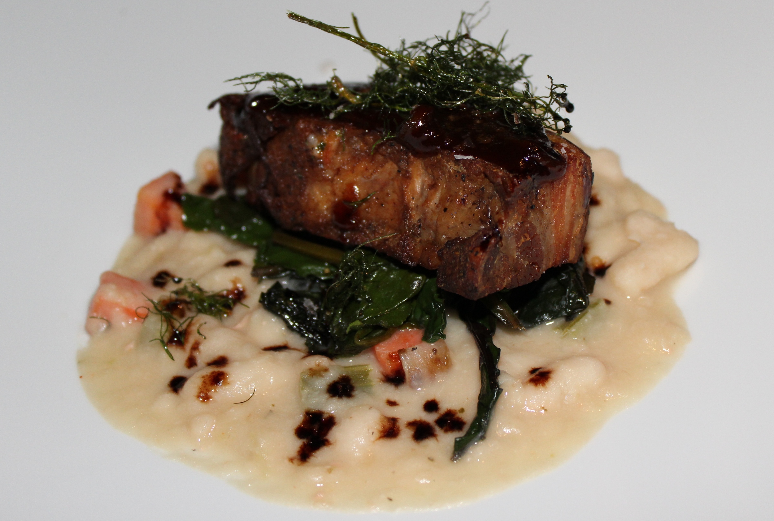 Berkshire Pork Belly, Cannellini White Bean Chowder, Braised Swiss Chard, Apple-Balsamic Syrup