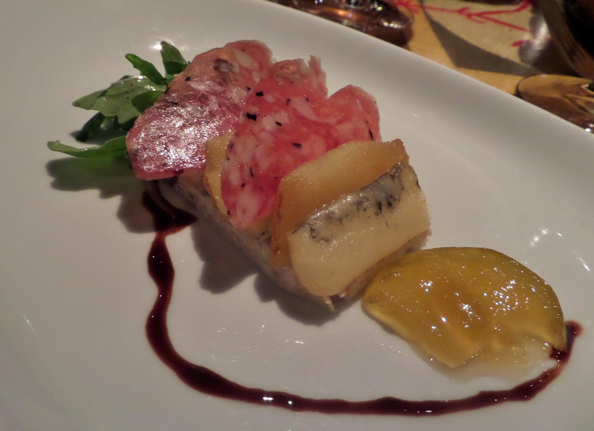 Cheese and charcuterie course. Morbier cheese, black truffle salami, caramelized apple, white watermelon-mustard jelly.