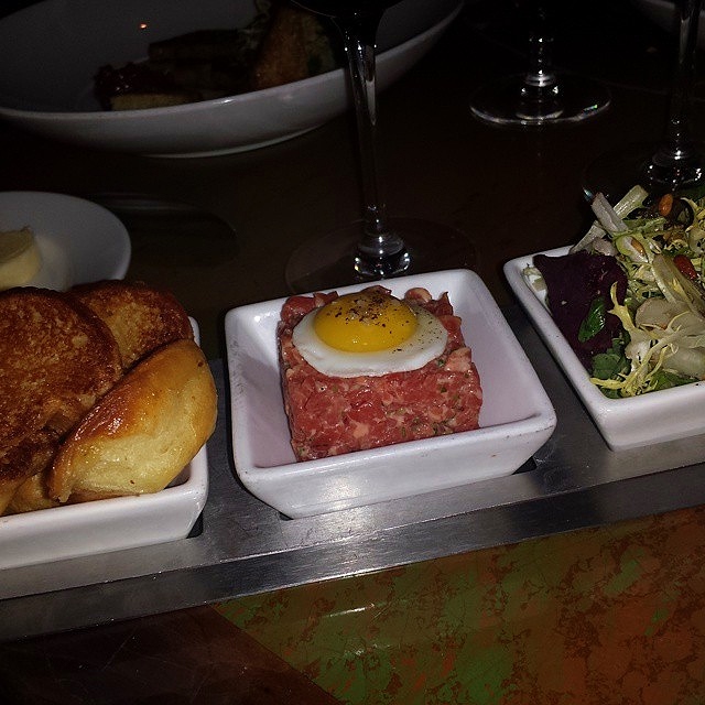 Steak tartare with black truffle aioli and quail egg with brioche.