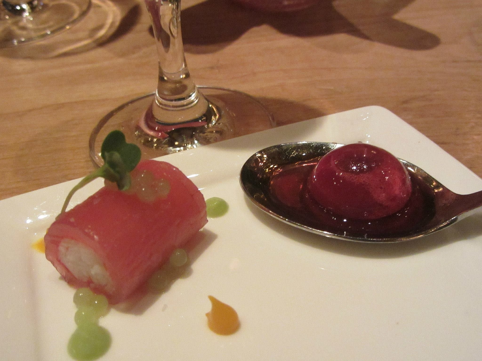 King crab and tuna roulade with green apple caviar and mango puree, and a "cherry bomb" with verjus. 