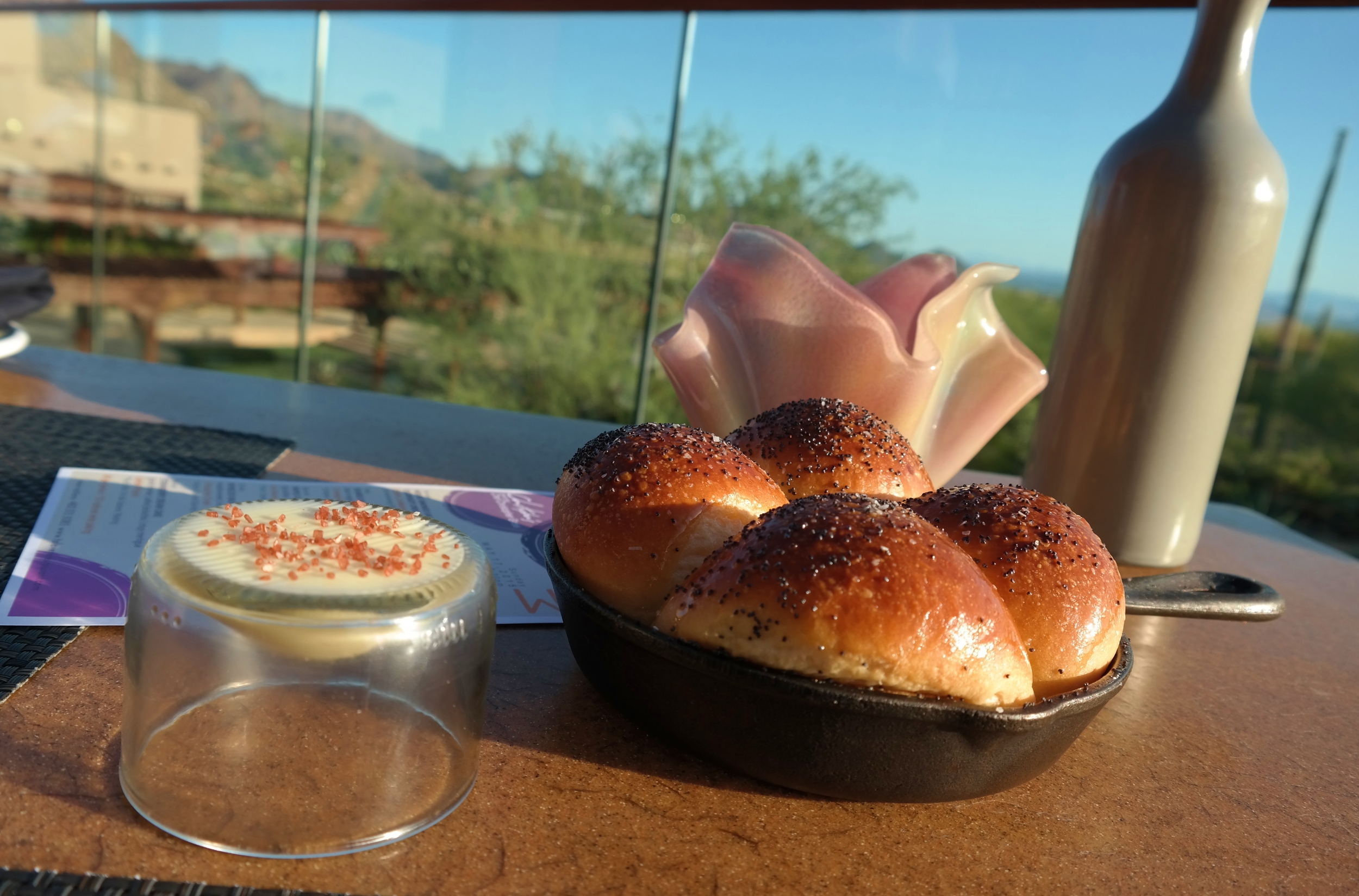 Warm poppy seed rolls with butter and Hawaiian pink salt