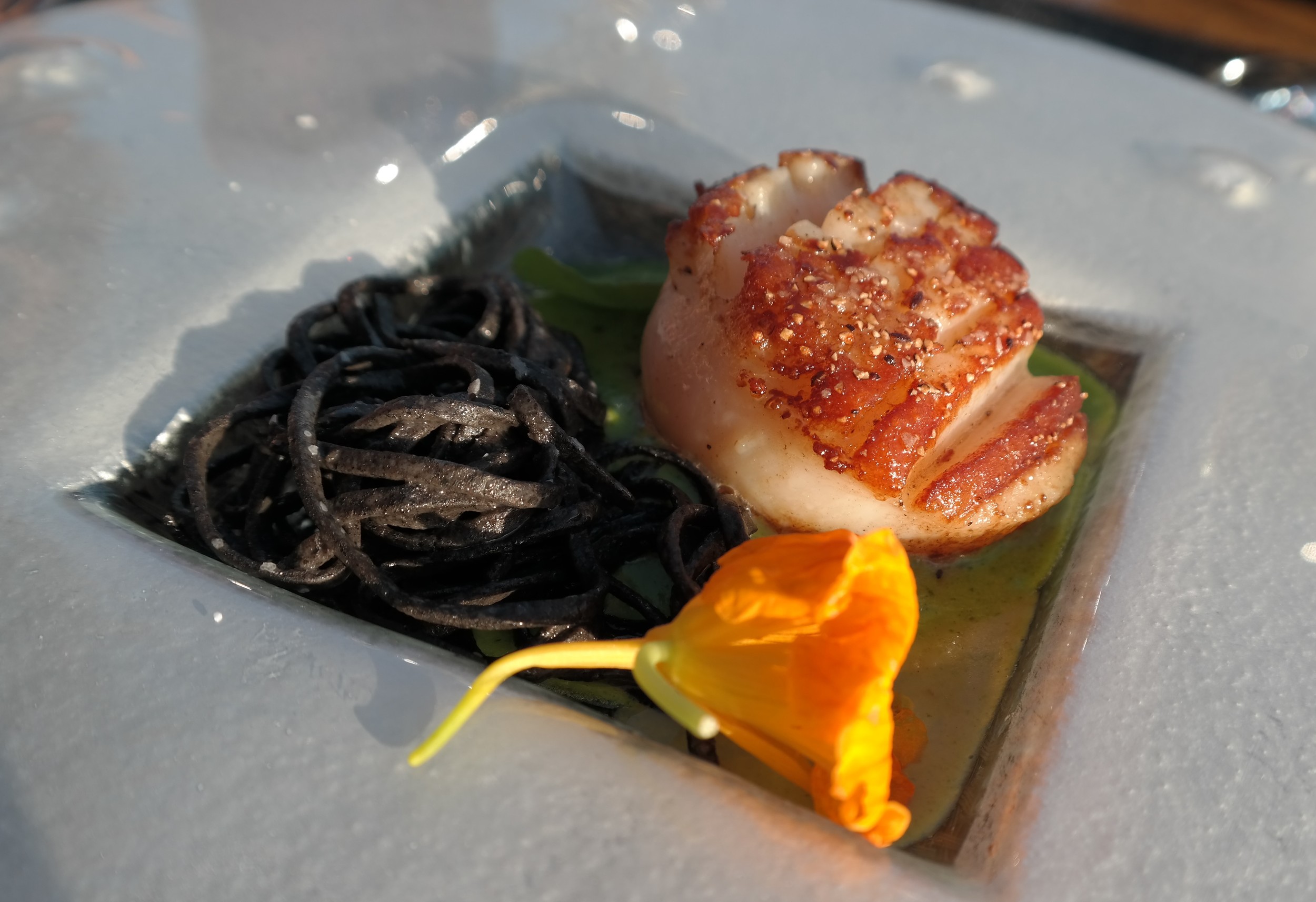 Christopher's diver scallop with mushroom pasta, English pea puree and nasturtiums