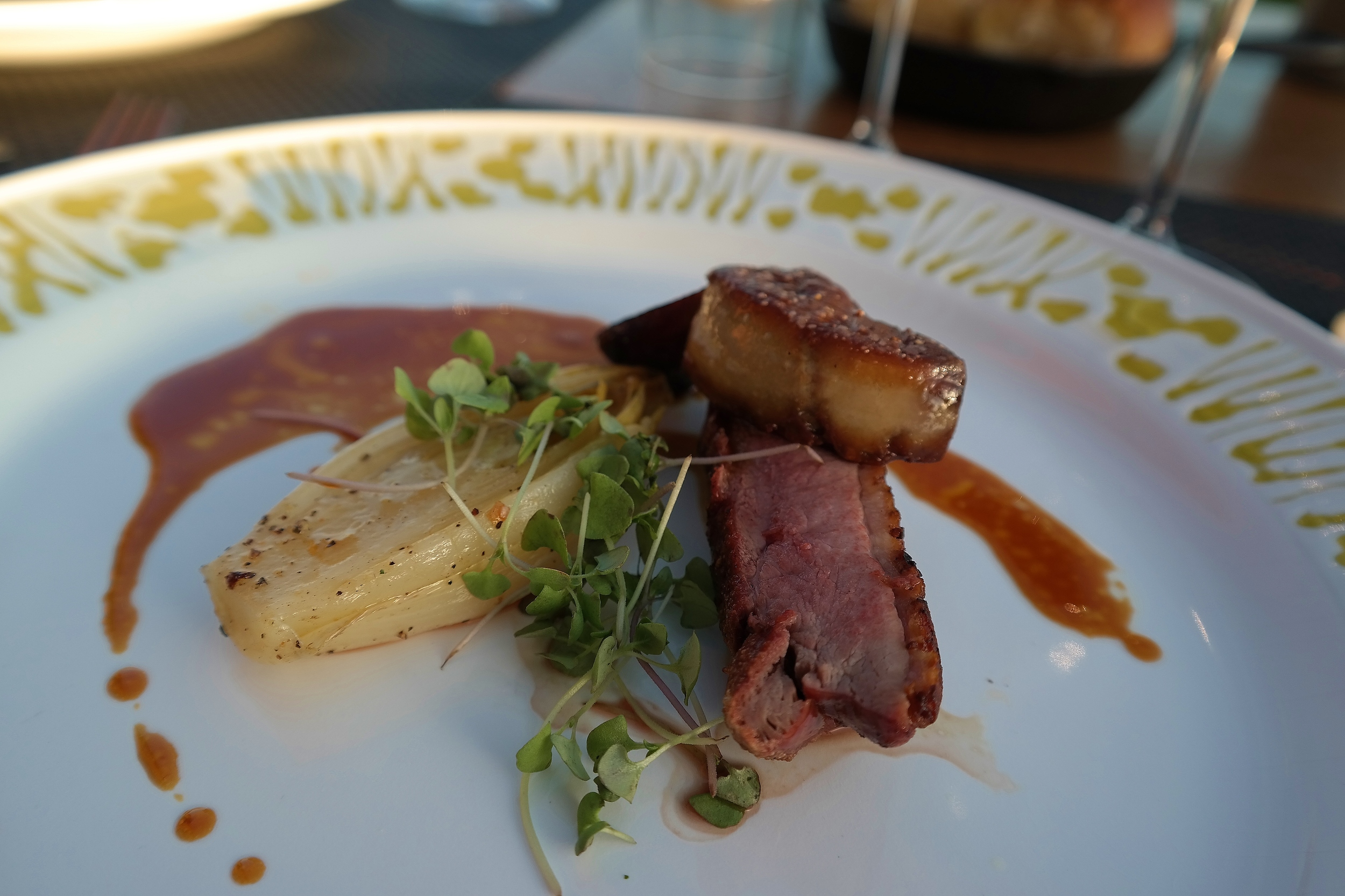 Mel's duck breast with seared foie gras, fig brulee, endive, and orange gastrique