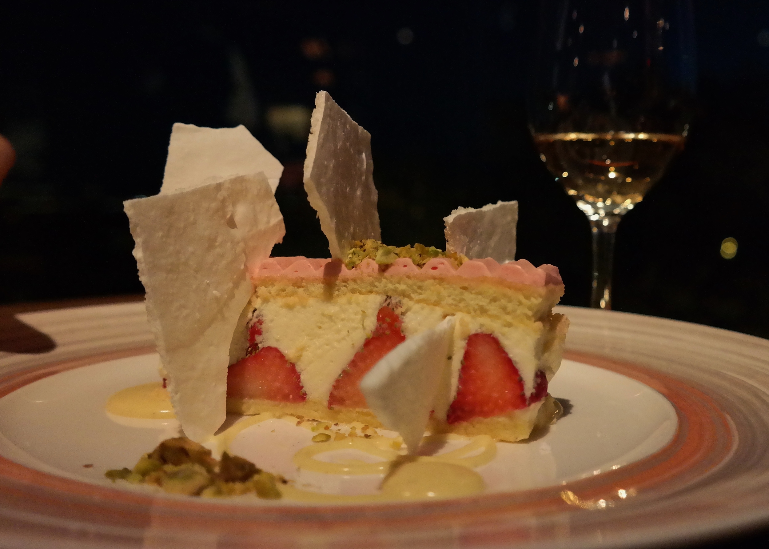 Strawberry cream cake with Grand Marnier, pistachios, and crispy meringue