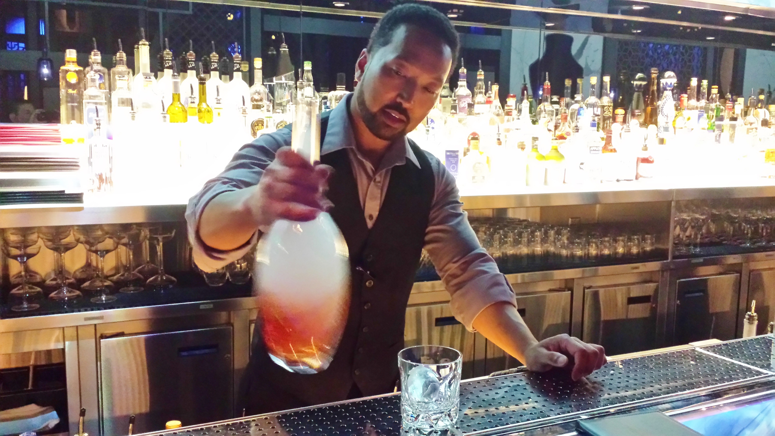 Adrian mixing up a Smoky Negroni