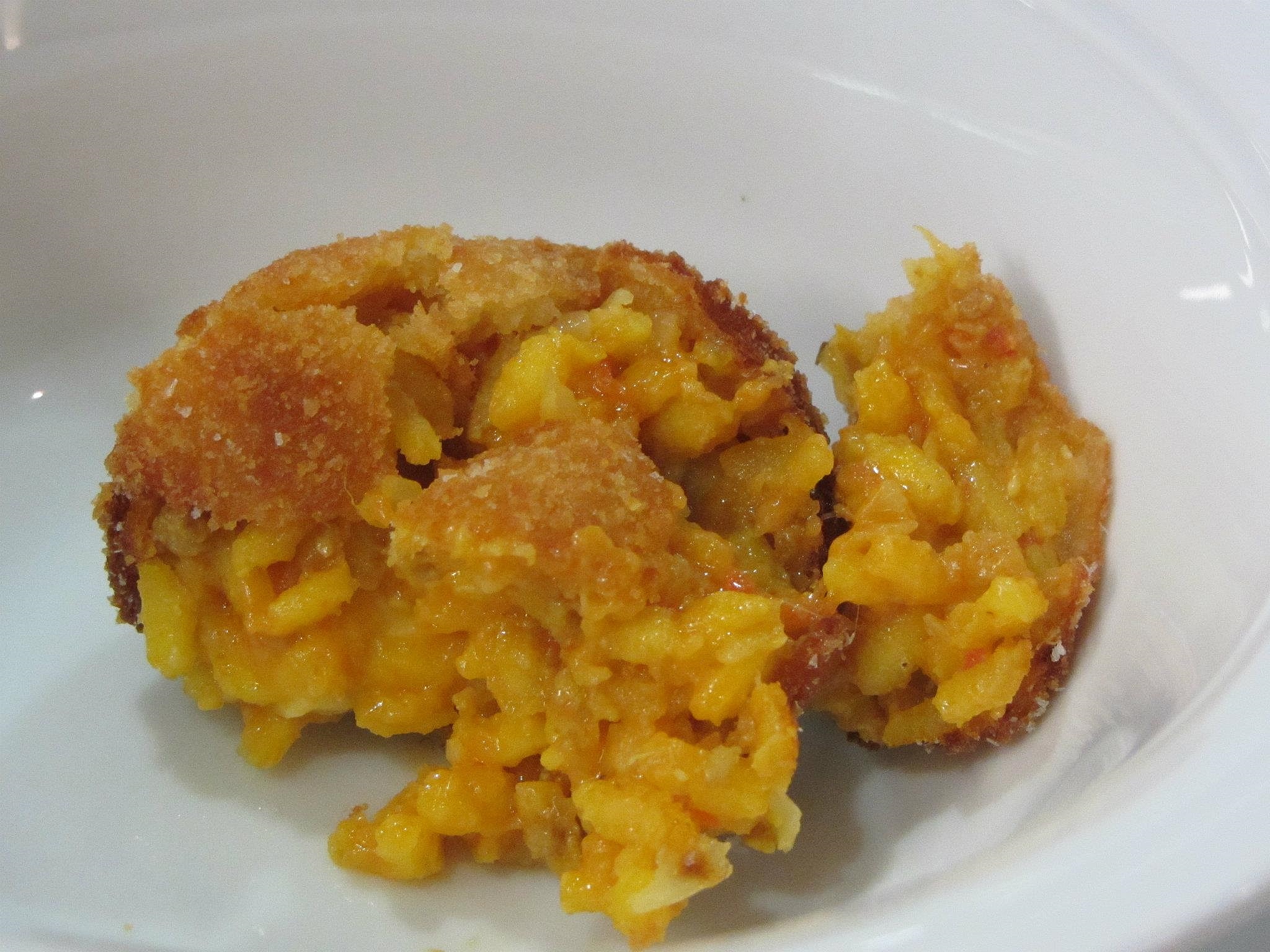 Arancino with saffron and mozzarella.