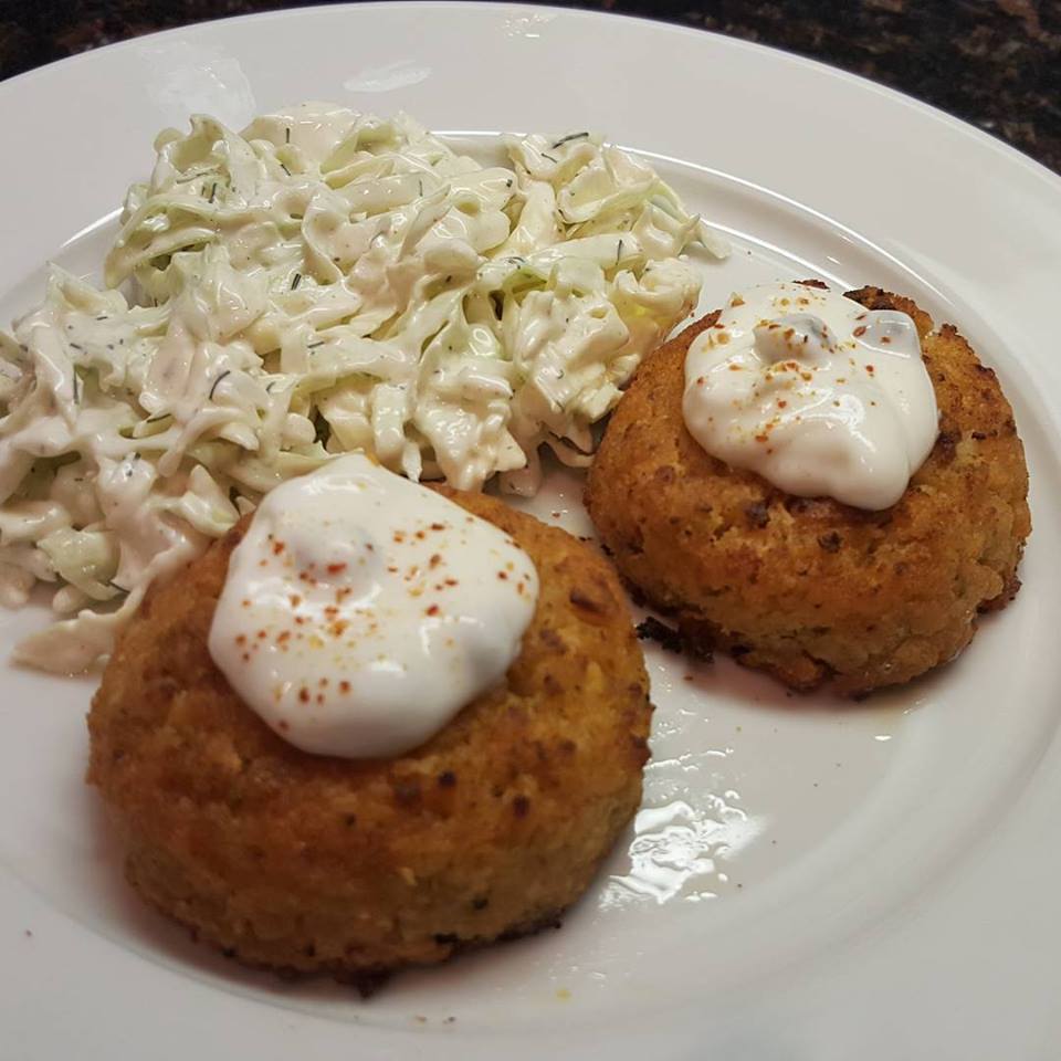 Crab cakes with dill slaw and caper-lemon-espelette yogurt sauce.