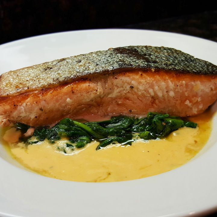 Crispy-skinned chinook with garlic spinach and shrimp bisque sauce