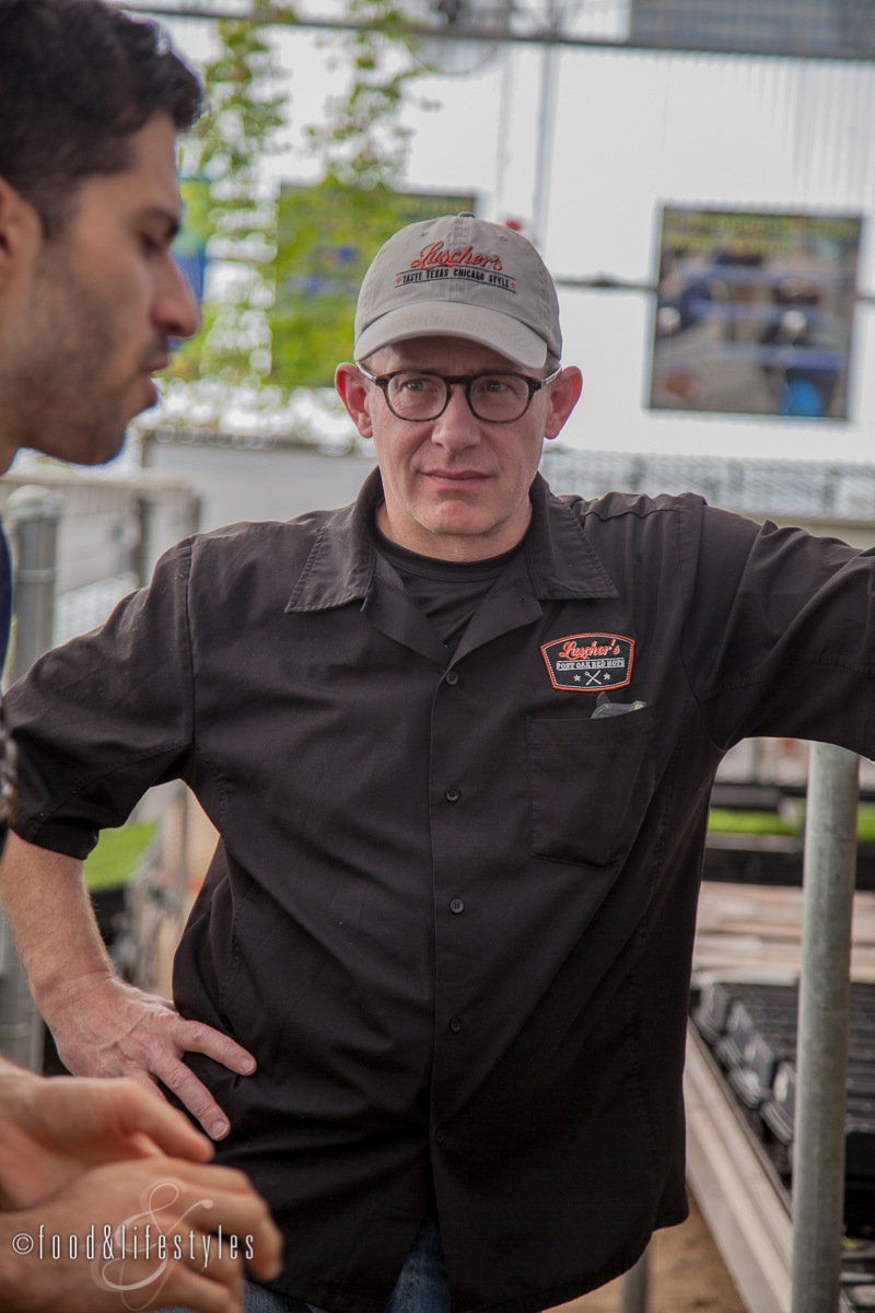 Chef Brian Luscher listening to Joseph Martinez