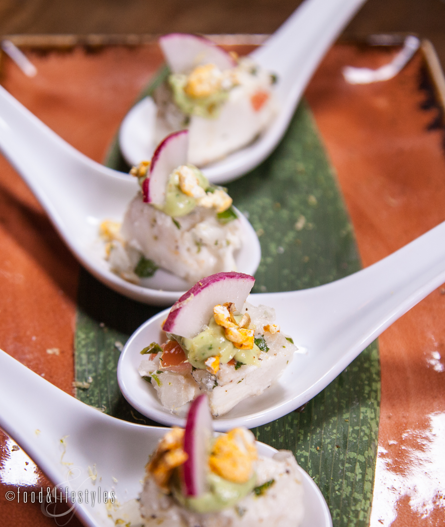 Escolar ceviche with pickled onion, chili popcorn, and avocado mousse