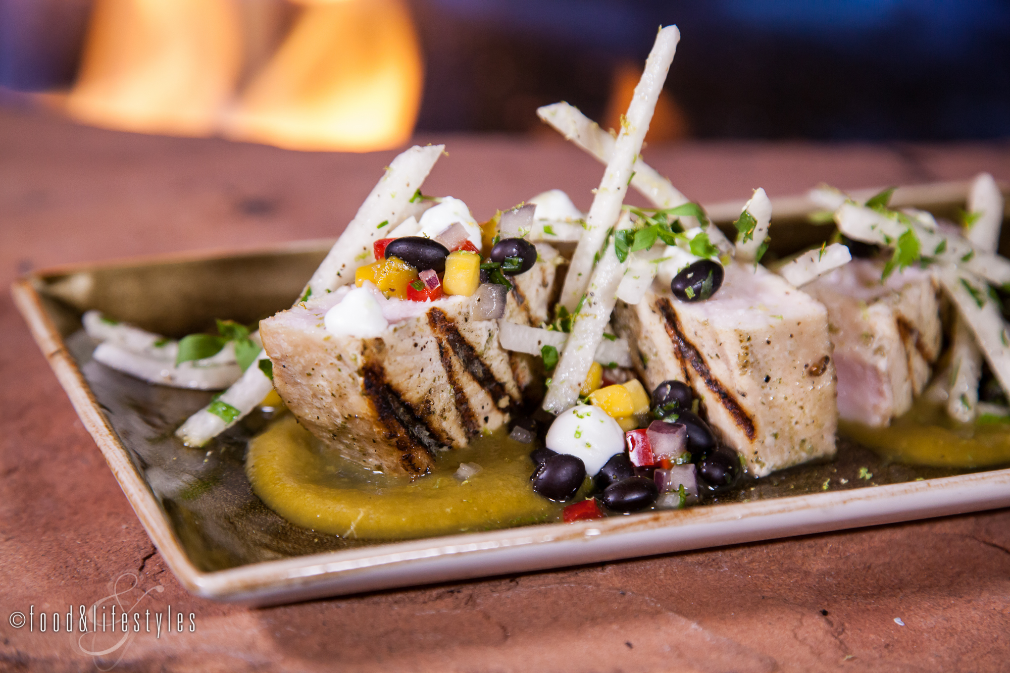 Citrus swordfish with tomatillo-pineapple puree, mango-black bean salsa, jicama, and lime buttermilk