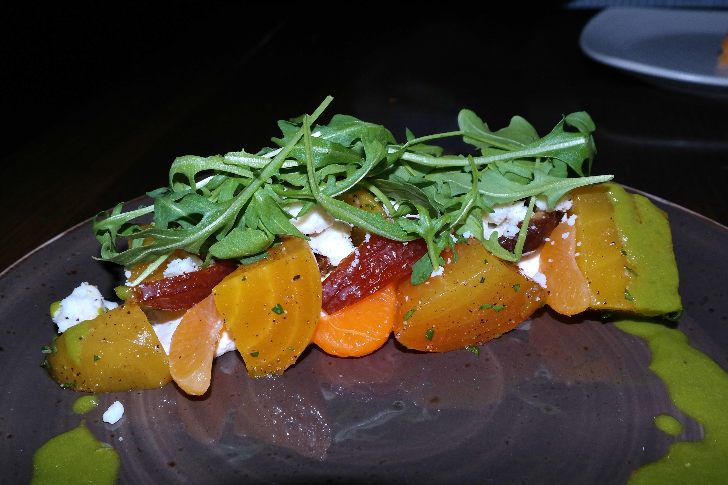 Roasted beet salad with Medjool dates, arugula, clementine, and Crow's Dairy black pepper feta