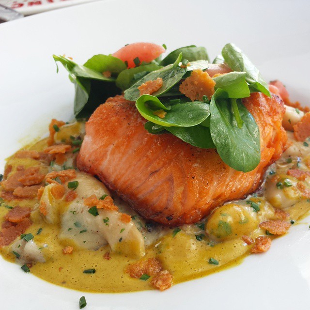 Scottish salmon with white bean-parmesan fondue, curry, and buna-shimeji mushrooms.