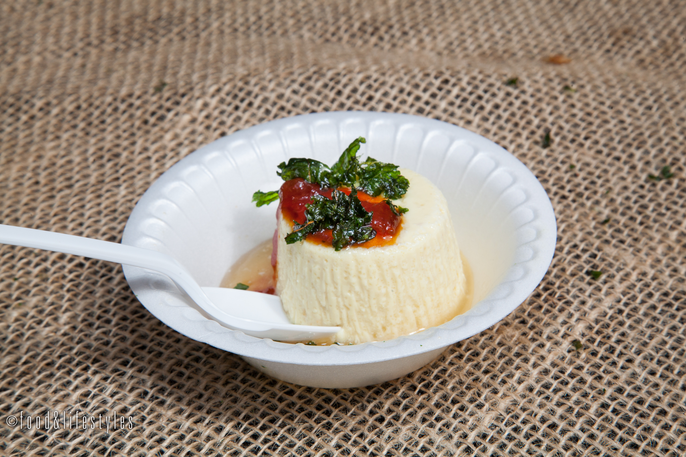 Cauliflower panna cotta with tomato jam, bacon dashi, and crispy kale by Elements 