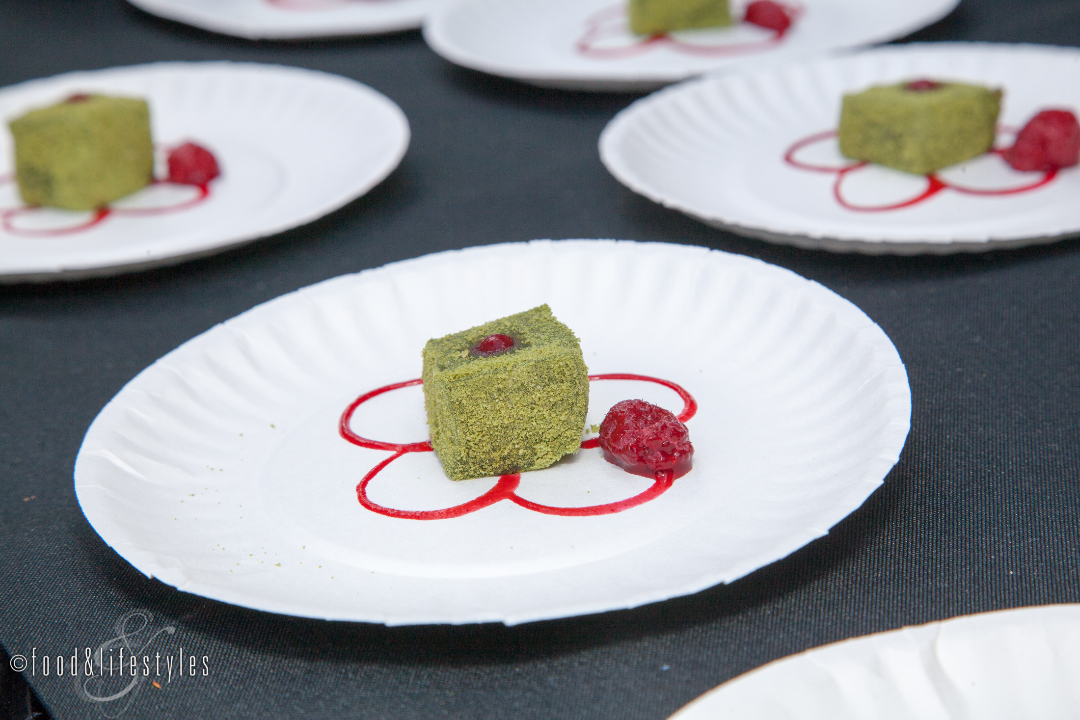 Hana's Matcha Mochi Warabi Mo Hi (pounded rice squares in matcha powder with raspberry)