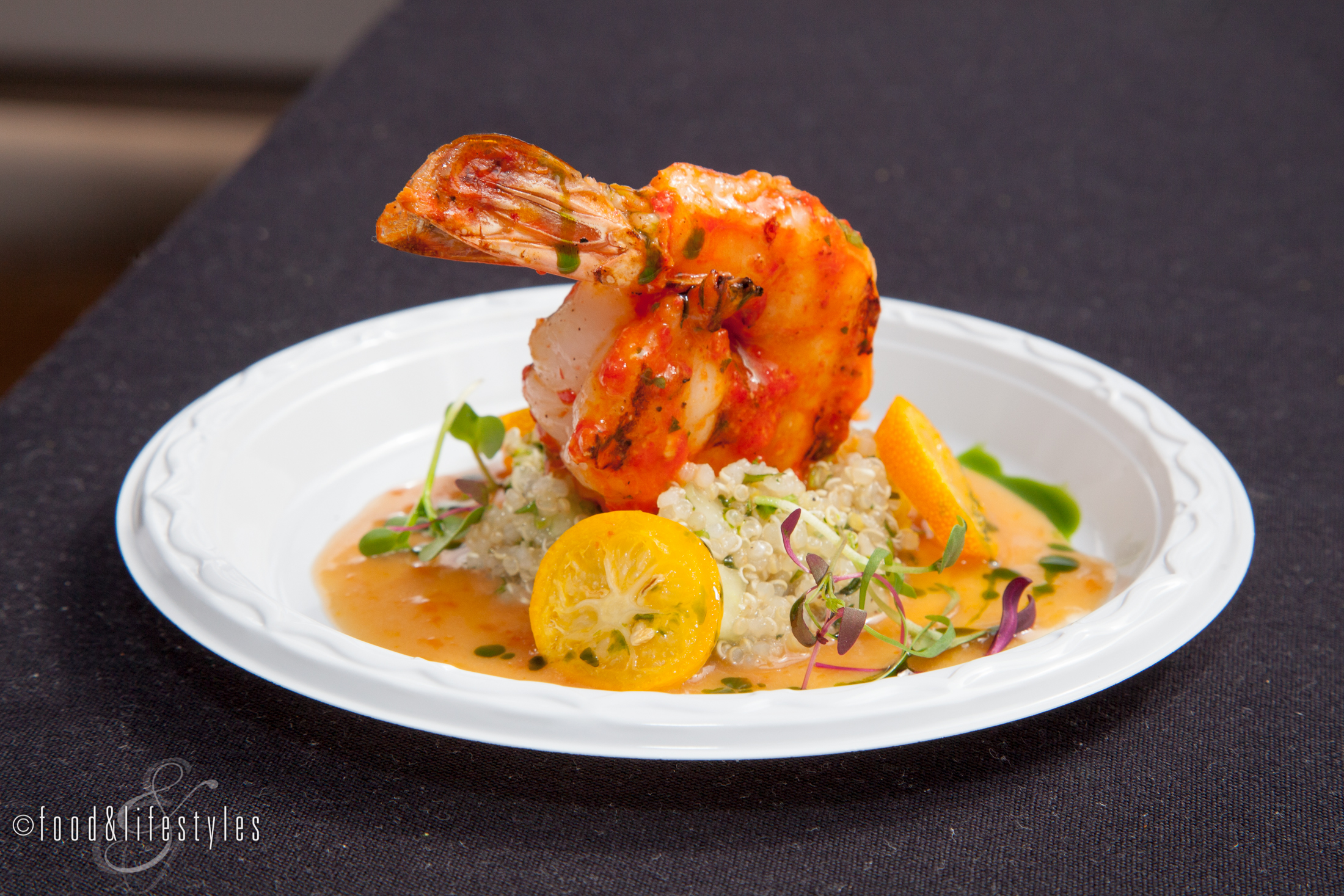 Different Pointe of View's piquillo pepper shrimp with quinoa, kumquat reduction, basil oil