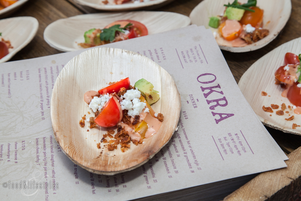 Tomato salad with goat feta and crispy chicken skin from Okra