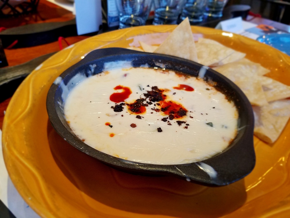 Queso fundido with queso Chihuahua, roasted poblanos, chile ancho, and Jalisco salsa