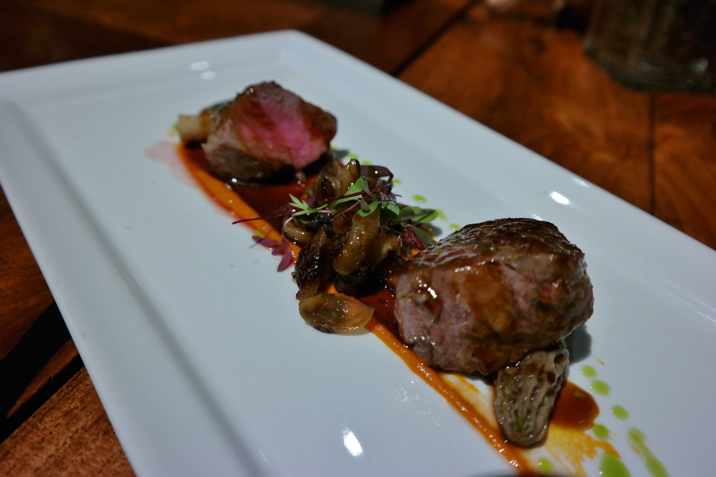 Lamb with cipollini onions, morel mushrooms, and tomato puree