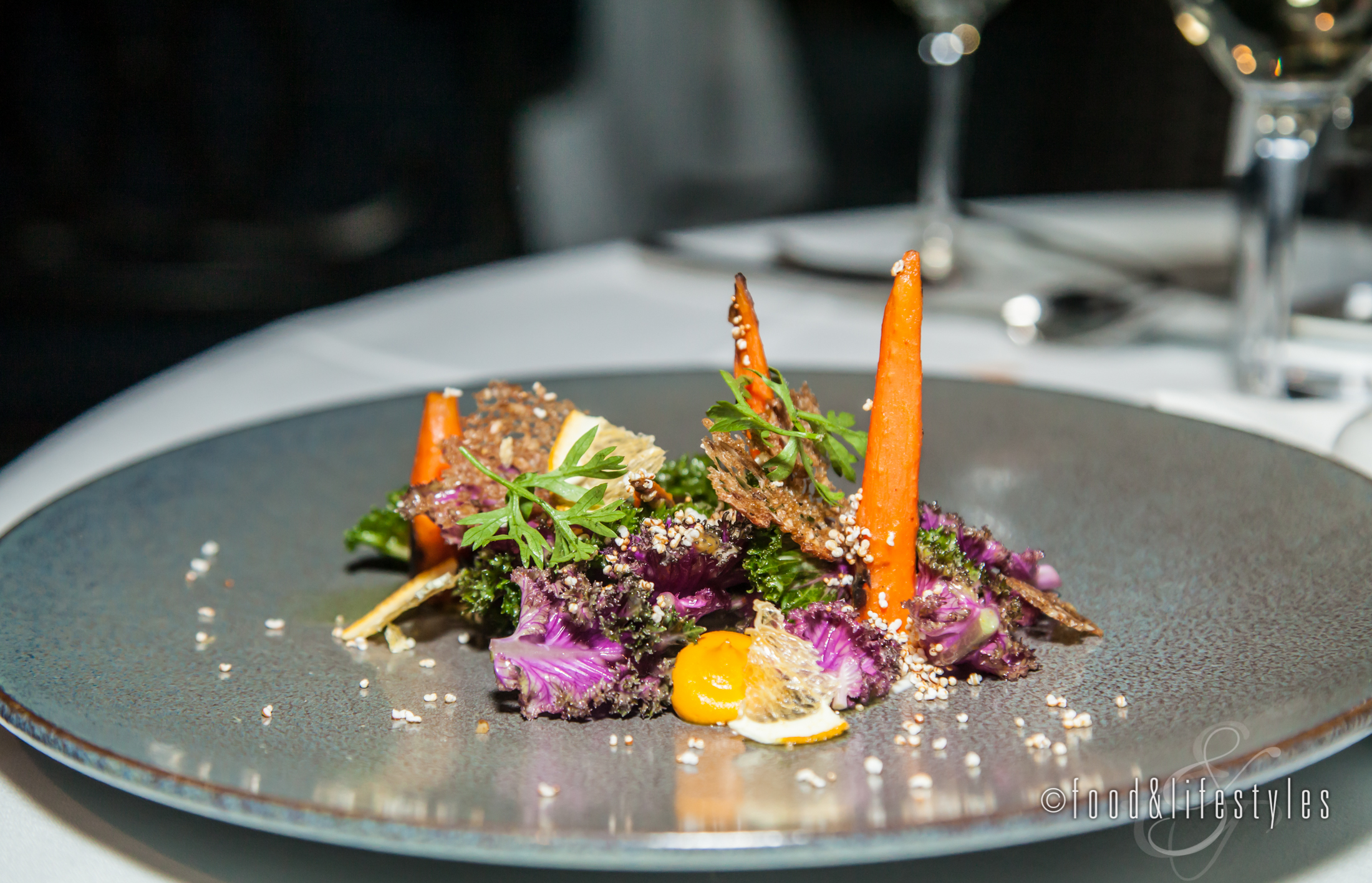 Kale salad with carrots, robiola, amaranth and orange blossom vinaigrette