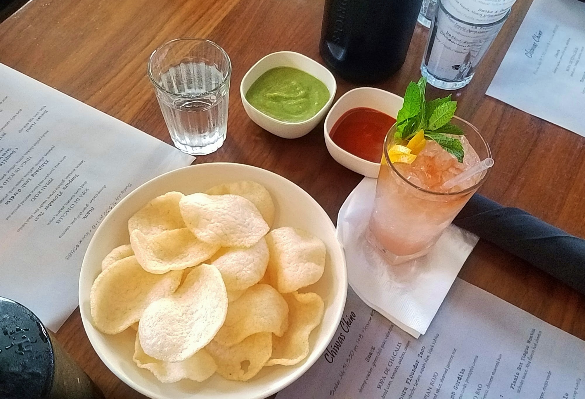 Greeted with snacks: Shrimp crackers with green chile guacamole and Valentina hot sauce