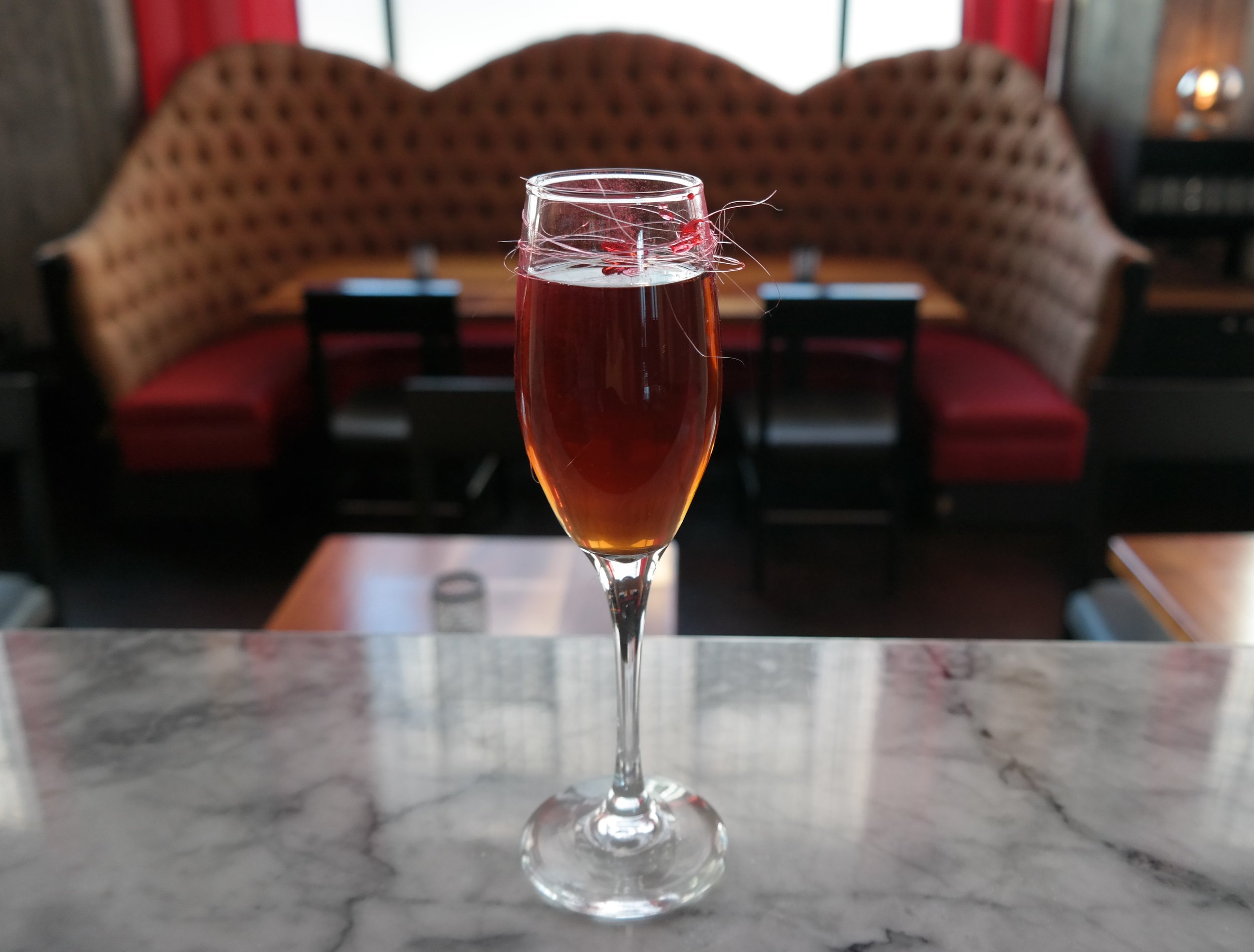 From Friends with Benefits , created by Declan McGurk of the American Bar at The Savoy in London: The Roaring '50s, made with reposado tequila, Cynar (an artichoke amaro), Cocchi Vermouth, housemade grenadine, and a spritz of absinthe. 