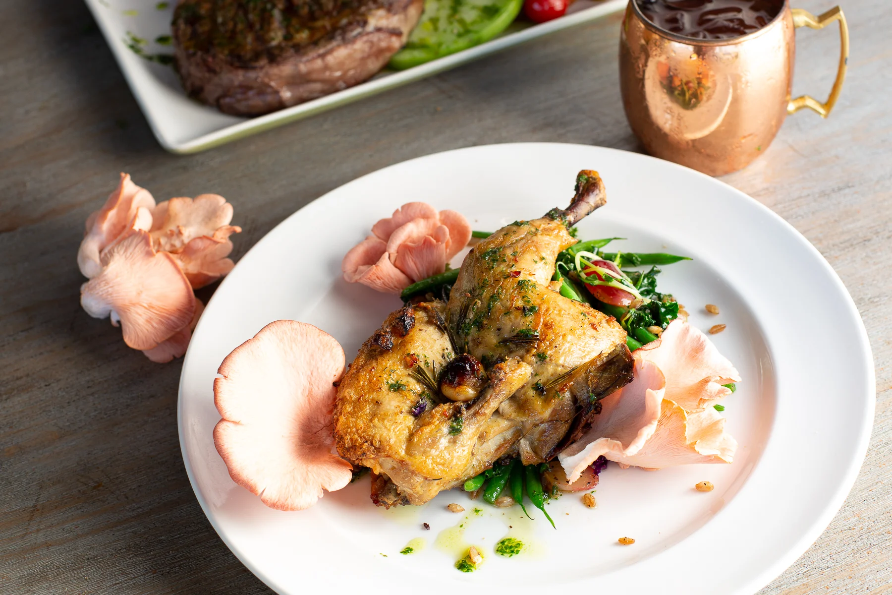 Brick chicken with Arizona Shade Farms pink bacon oyster mushrooms (Debby Wolvos)