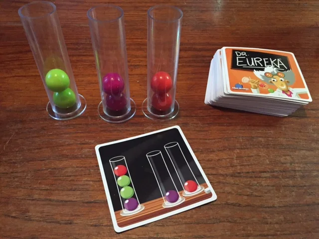 DR. EUREKA's test tubes, colored molecule balls, and challenge cards
