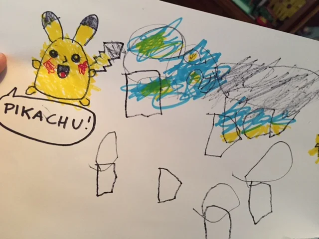 I drew Pikachu for Lyric to color in, and he did a pretty awesome job staying inside the lines. And then he drew his own Luxio next to that. Not too shabby! I see what he's trying to do there.