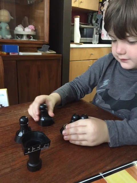 And then Lyric wanted to see how many pieces he could balance on an upside down Rook.