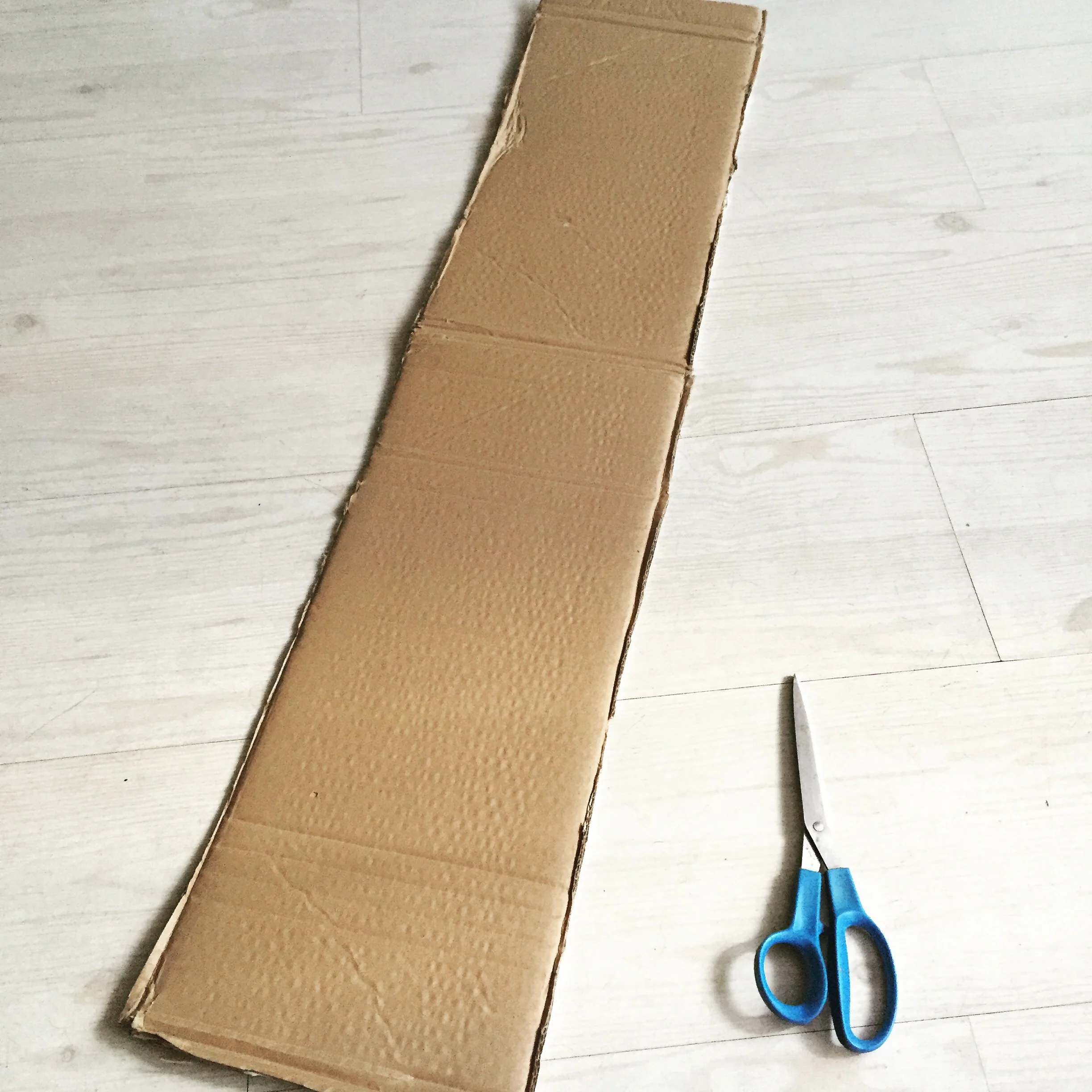 Step 2) trim cardboard to long strip