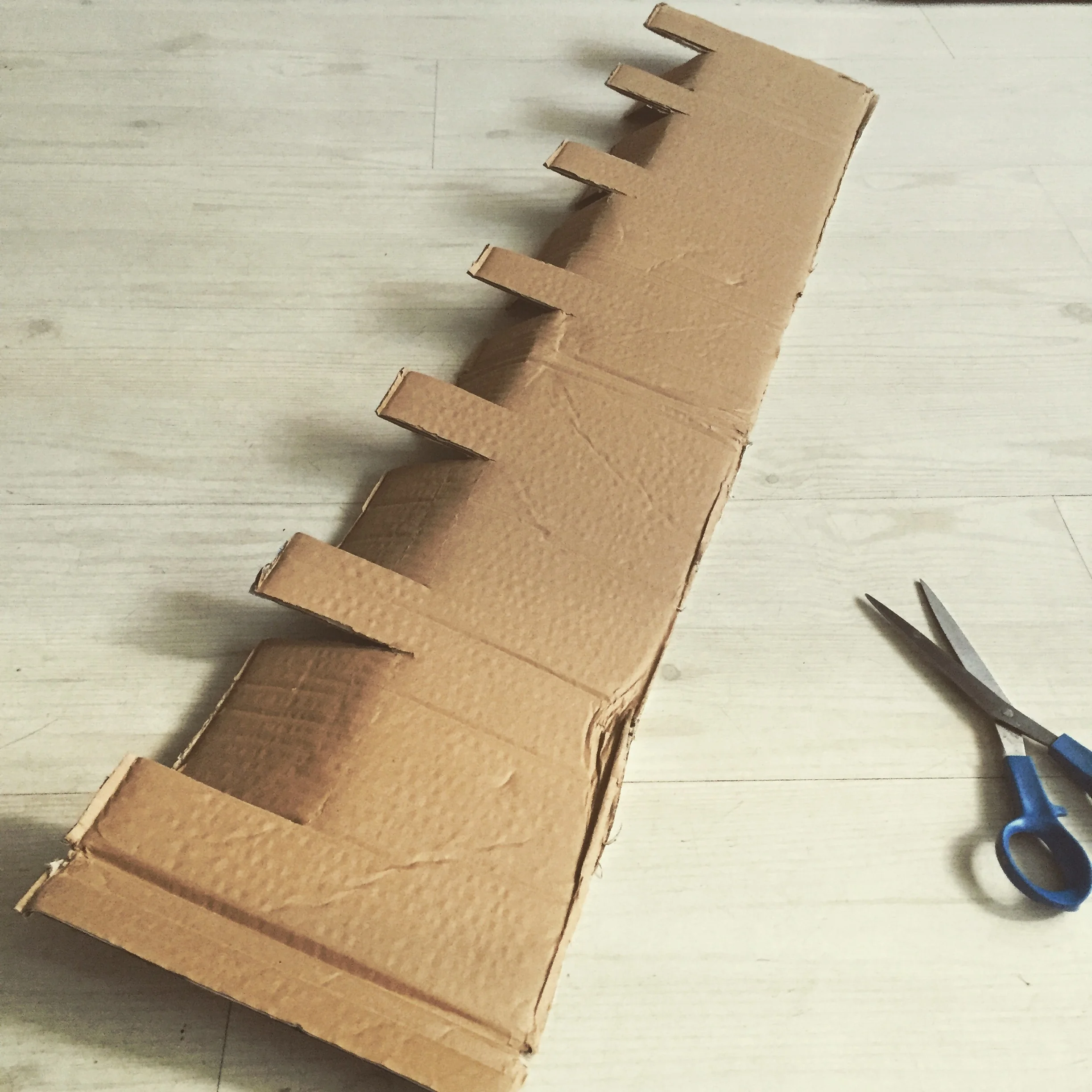 Step 3) cut crenellations and fold down longer flaps