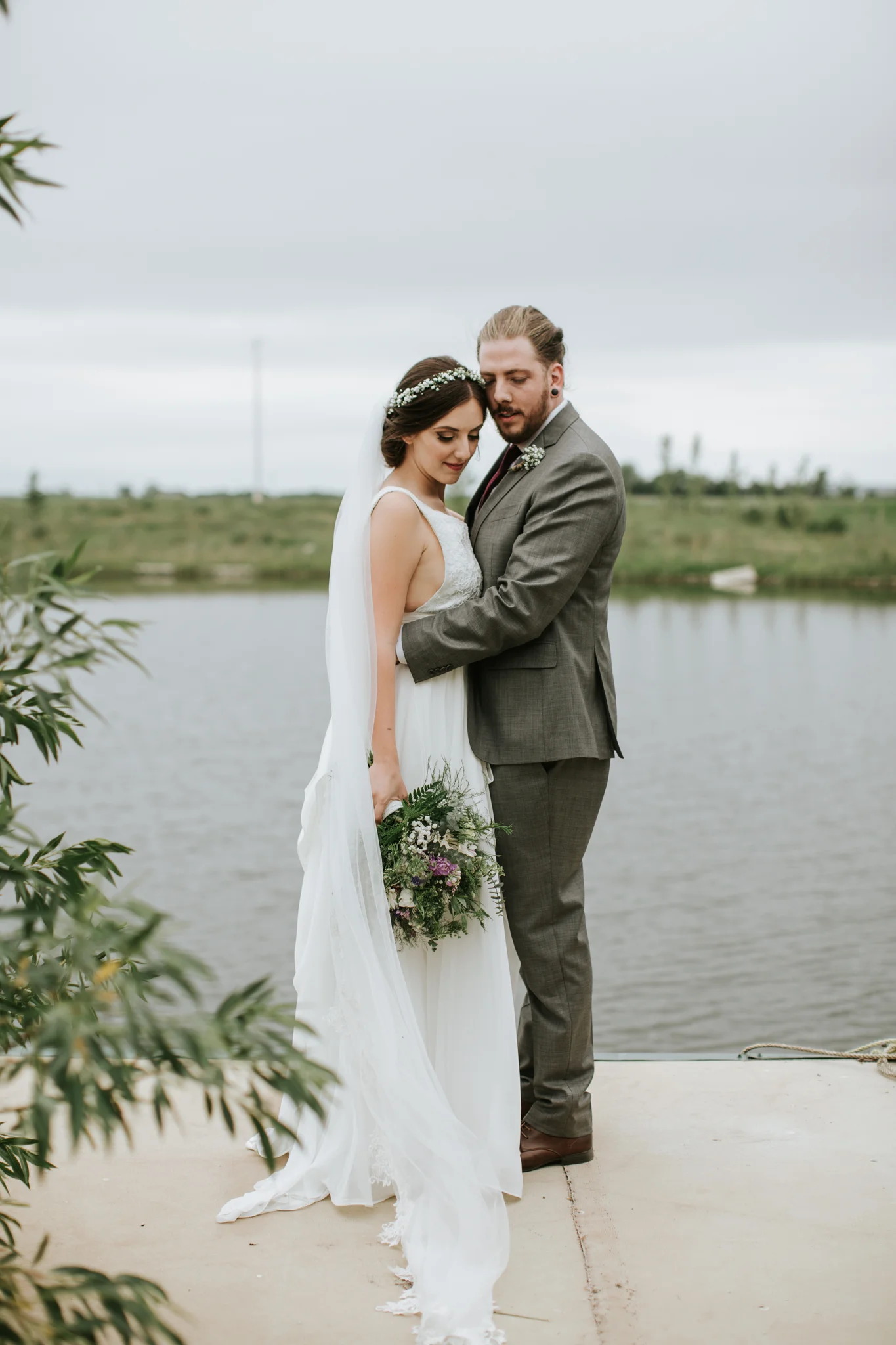 Bride and Groom with bouquet and boutonnières