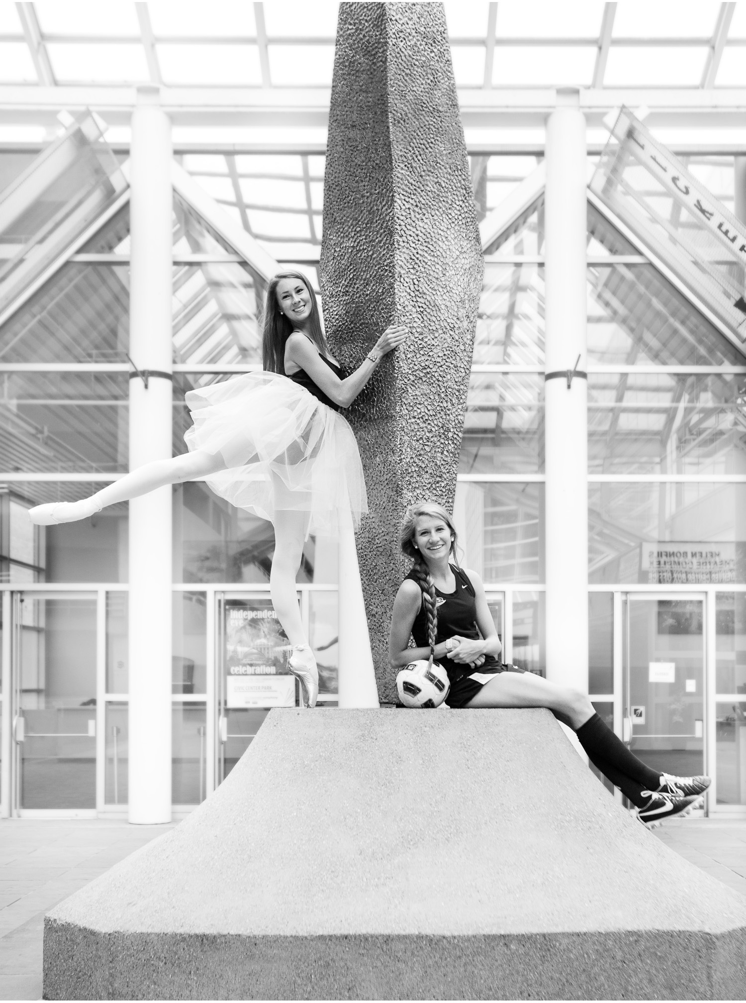 Downtown Denver cousins senior pictures featuring a ballerina and soccer player with photographer Jennifer Koskinen, Merritt Portrait Studio.