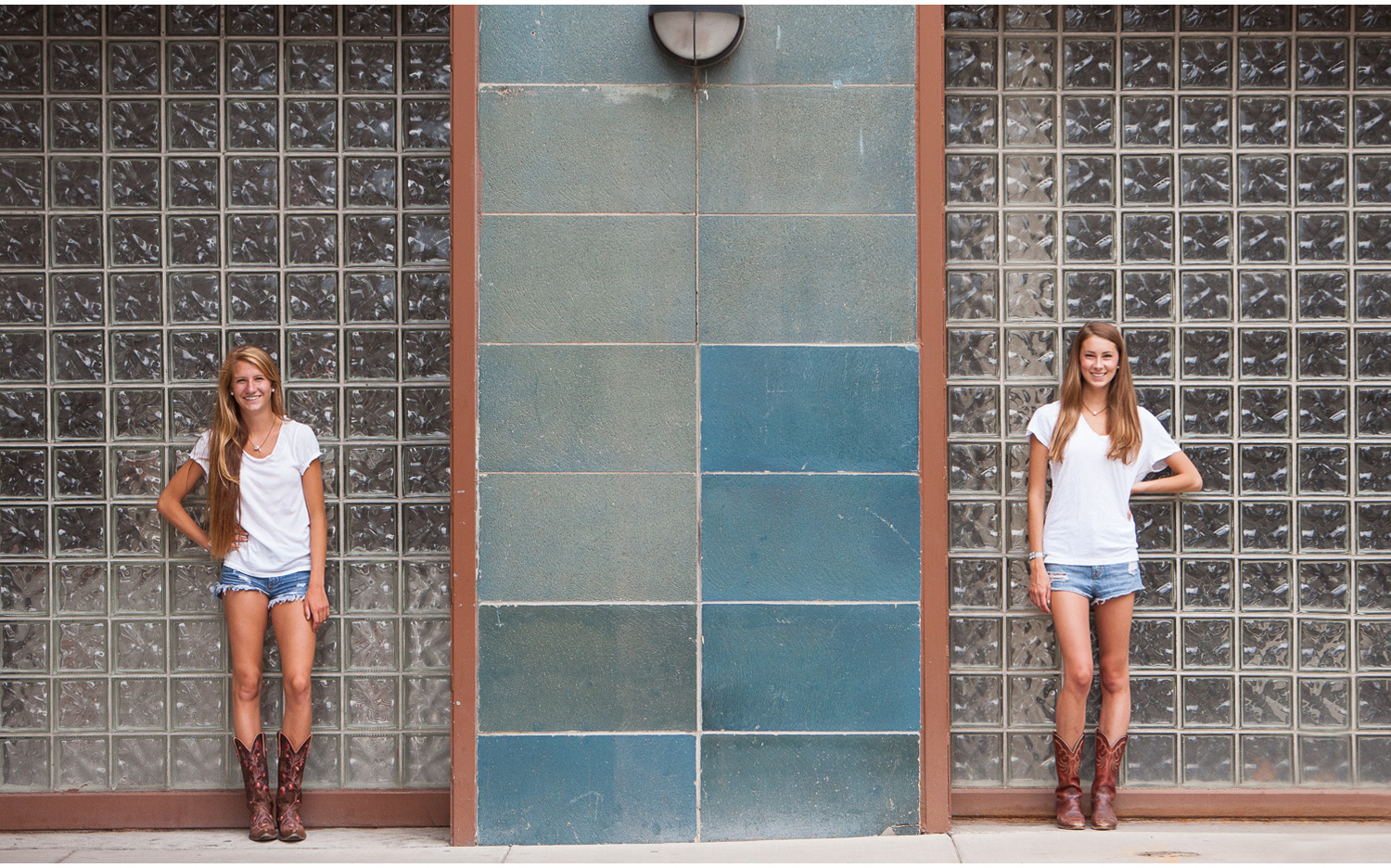 Downtown Denver, adorable best friends high school senior portrait session against blue tile and glass block wall with photographer Jennifer Koskinen, Merritt Portrait Studio.