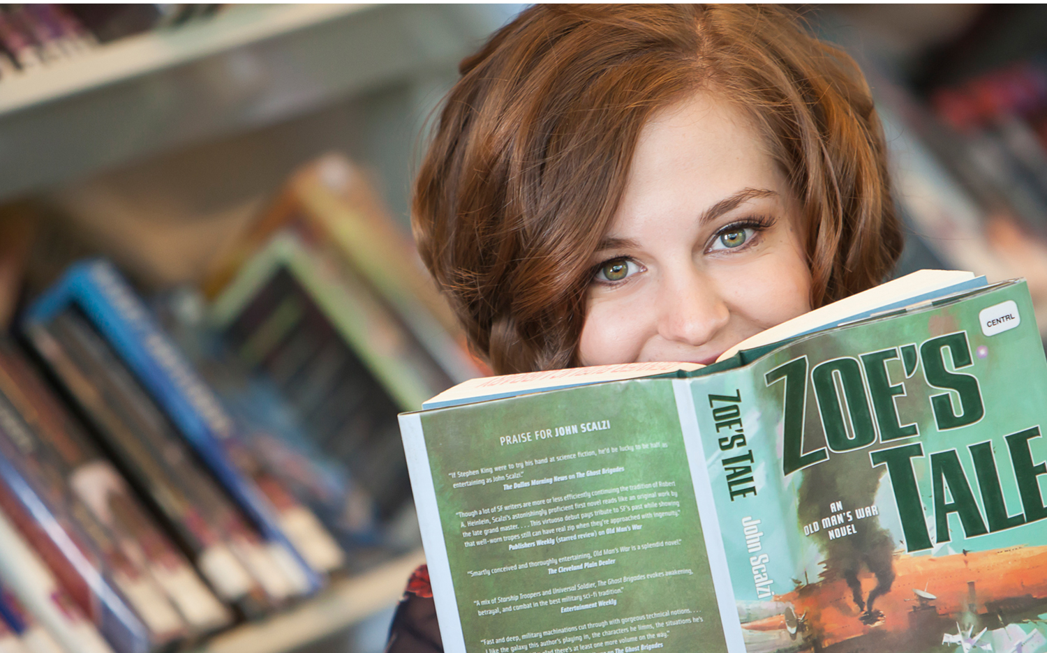 High School Senior Portrait with books inside Denver Public Library, with photographer Jennifer Koskinen of Merritt Portrait Studio