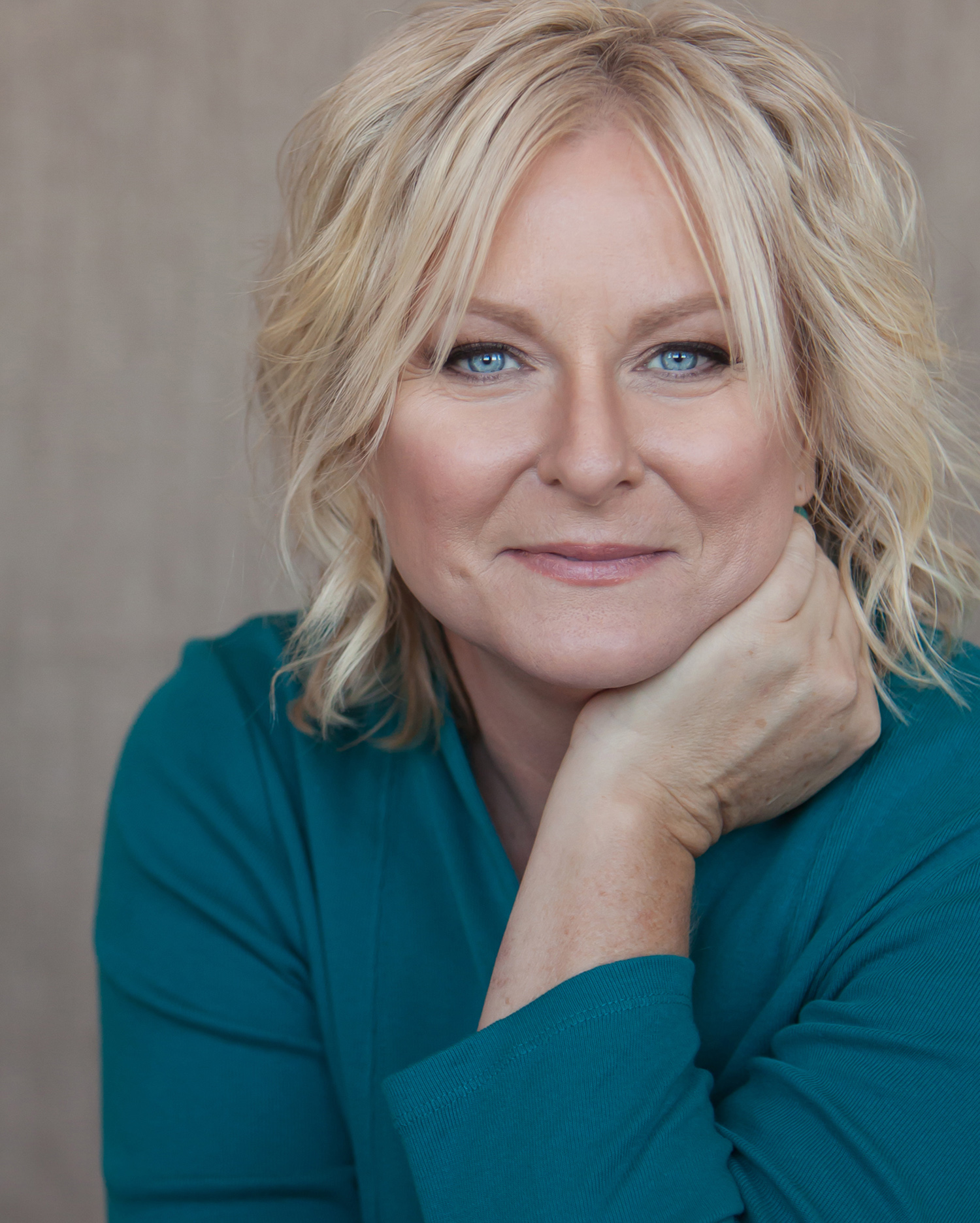 Gorgeous blue eyed woman photographed for personal branding session, by Denver photographer Jennifer Koskinen | Merritt Portrait Studio